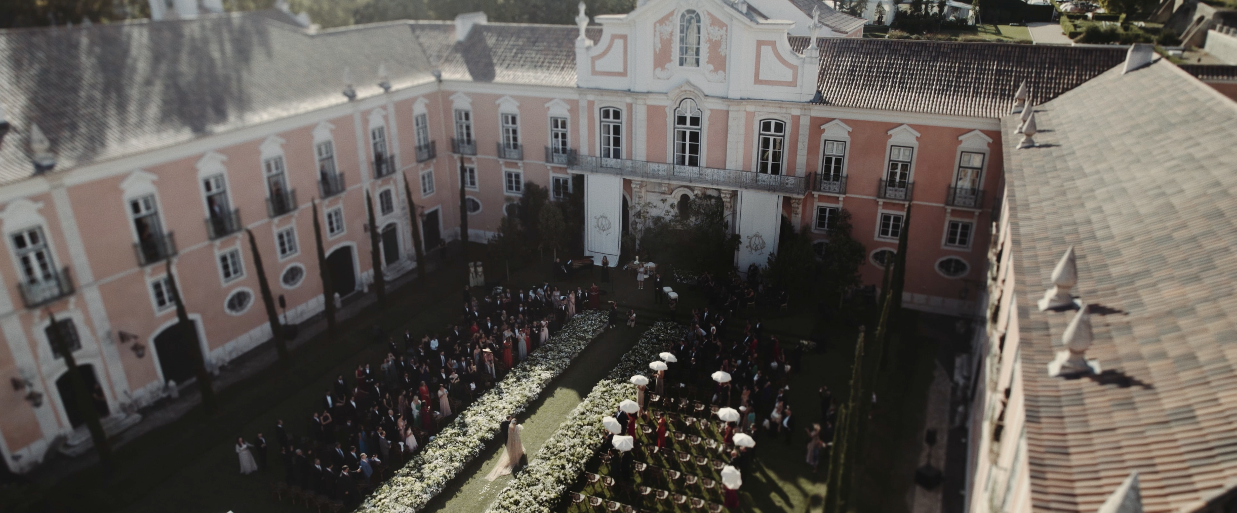 Grand wedding ceremony at Palácio do Correio-Mor courtyard. Destination wedding videographer Portugal by Maru Films.