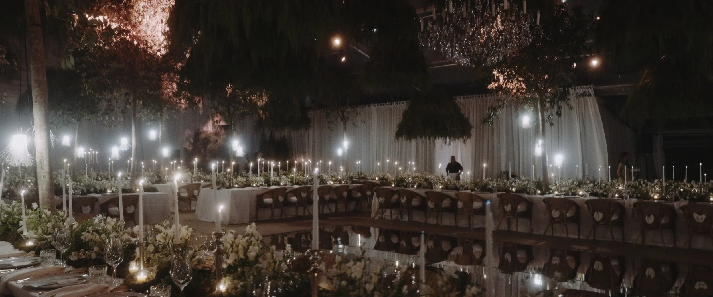 Atmospheric candlelit wedding reception dinner at Palácio do Correio-Mor. Luxury Portugal wedding design by Joana Aranha Studio captured by Maru Films.