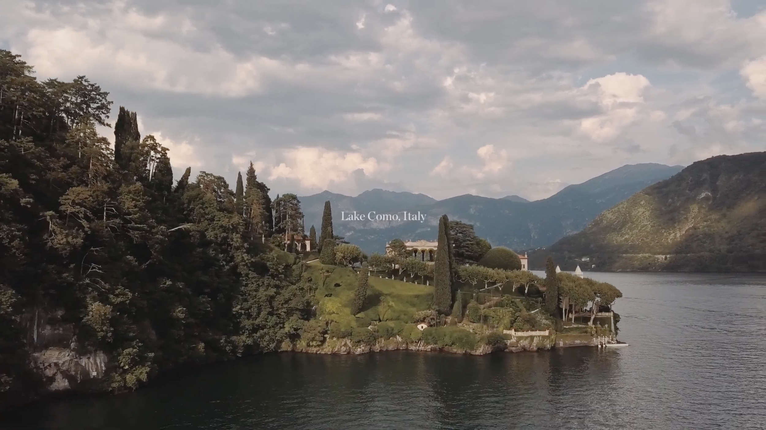 Panoramic view of Villa del Balbianello on the edge of Lake Como, Italy. An iconic destination wedding venue for an intentional celebration.