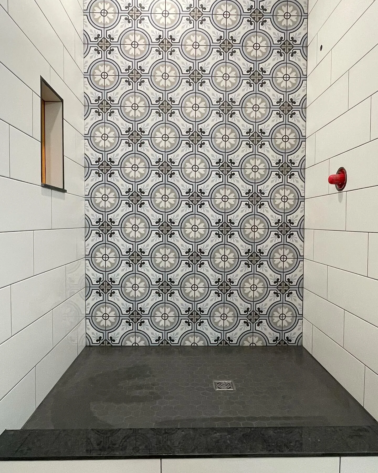 Done the tiling and grout on the first of 3 showers. White walls, Portuguese accent wall, and a hexagon base.  #tile #anotheronedone #construction #renovation #generalcontractor #contracting #kenisislake #haliburton #minden #waterlooregion #kitchener