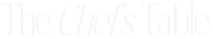 Text reading 'The Chef's Table' on a dark background.