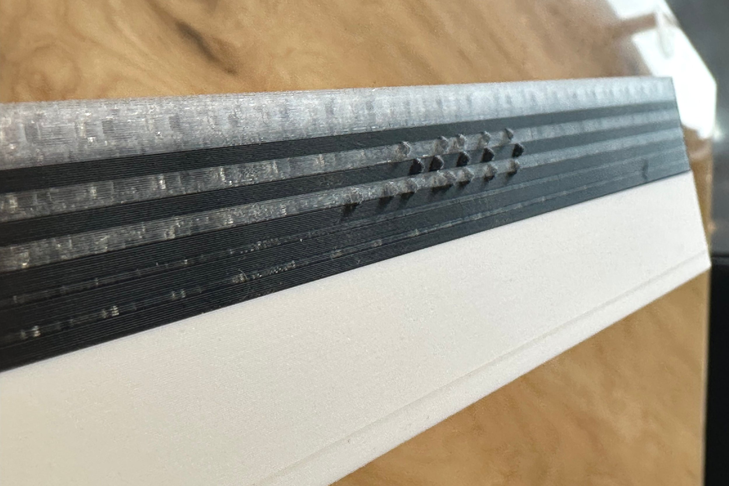 Othello case on its side, showing "OTHELLO" in braille along one edge of the case exterior.