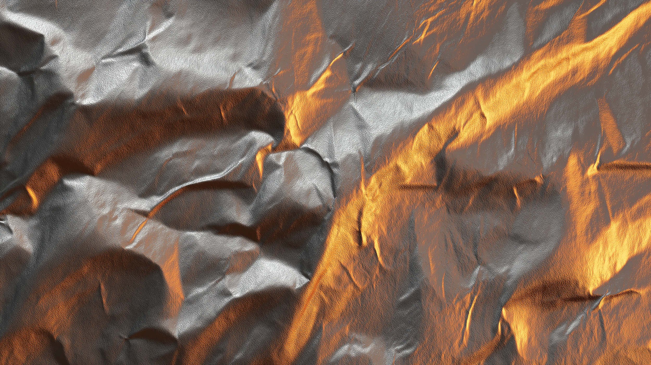 Surface de métal froissé avec des reflets dorés et argentés.