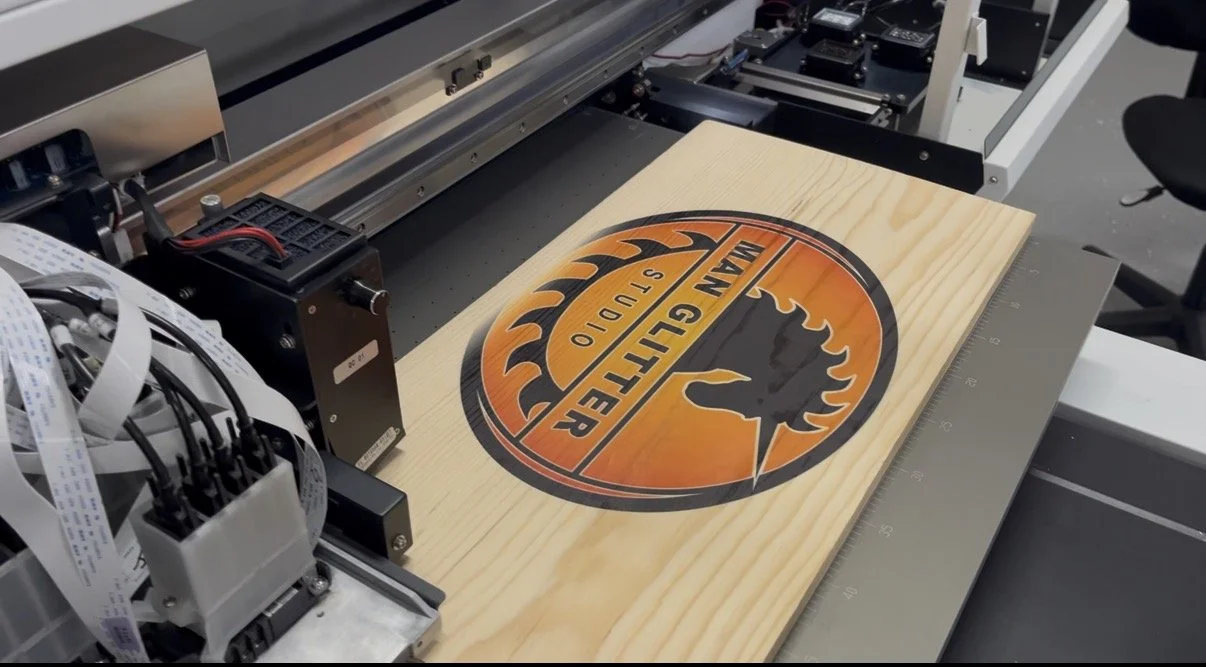 A CNC machine printing a wood sign with a Harley Davidson logo.
