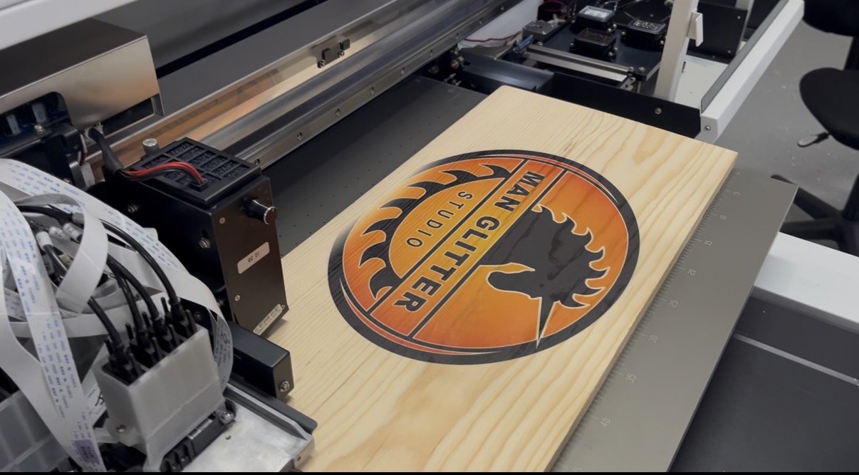 A CNC machine printing a wood sign with a Harley Davidson logo.