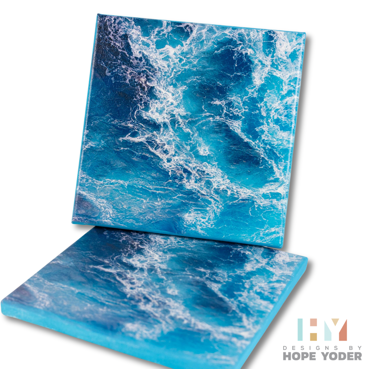 Two square canvas prints featuring ocean wave patterns in various shades of blue and white.
