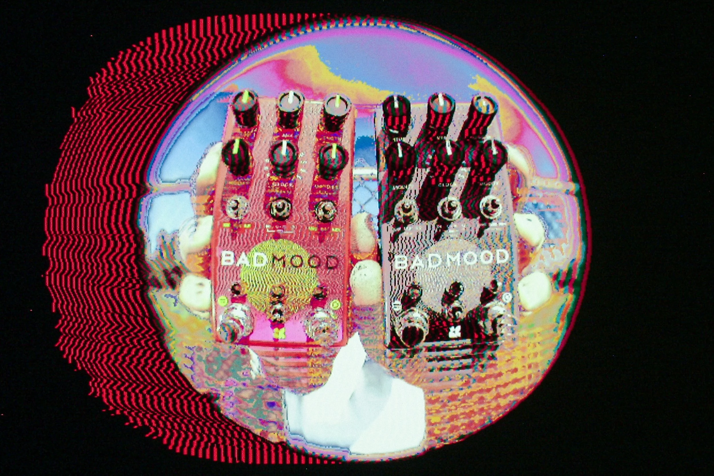 "BAD MOOD" effects pedal by Chase Bliss being held by two hands and run through a psychedelic photo filter.