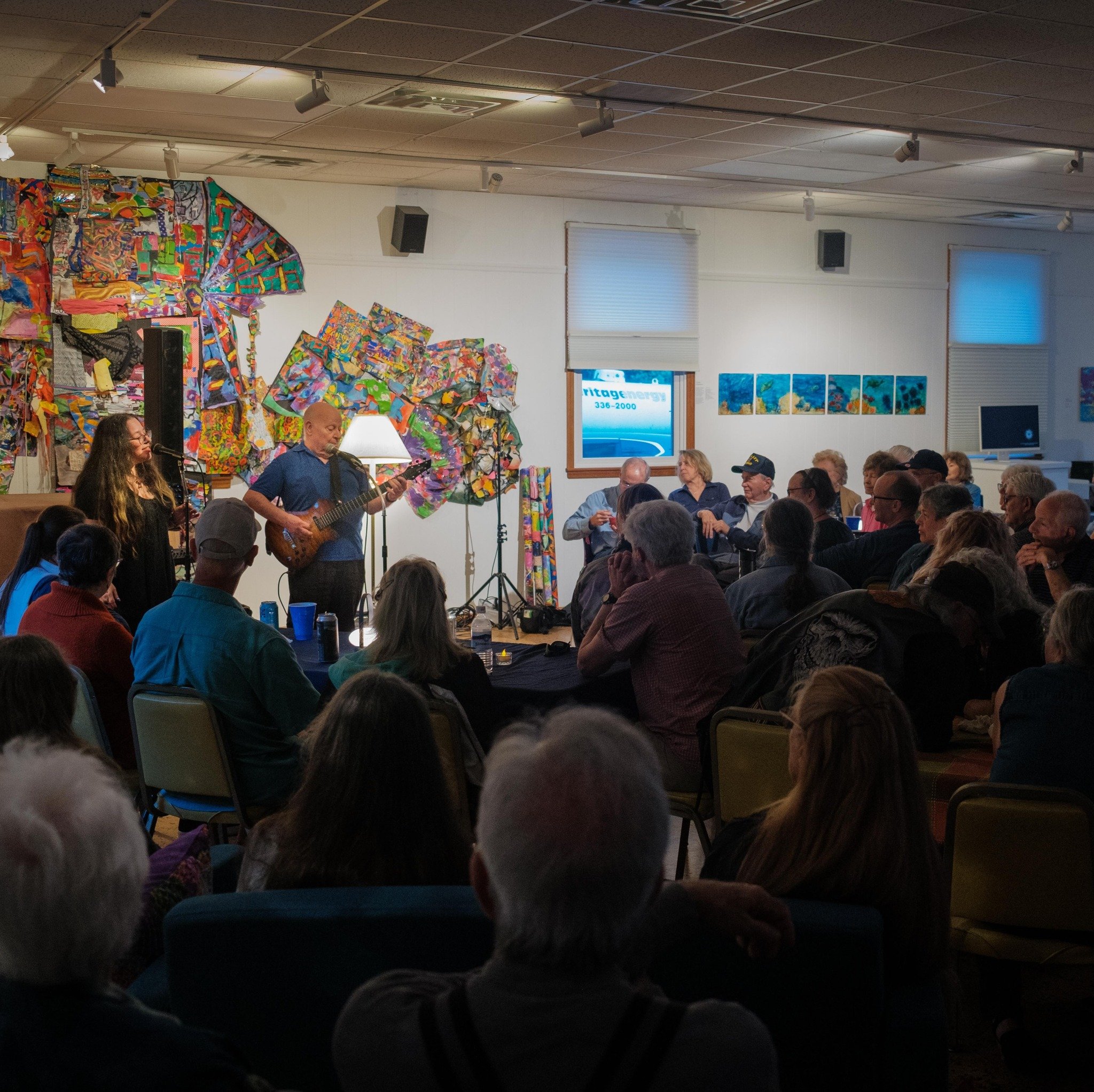 Community gathering at the Library for monthly Music Café