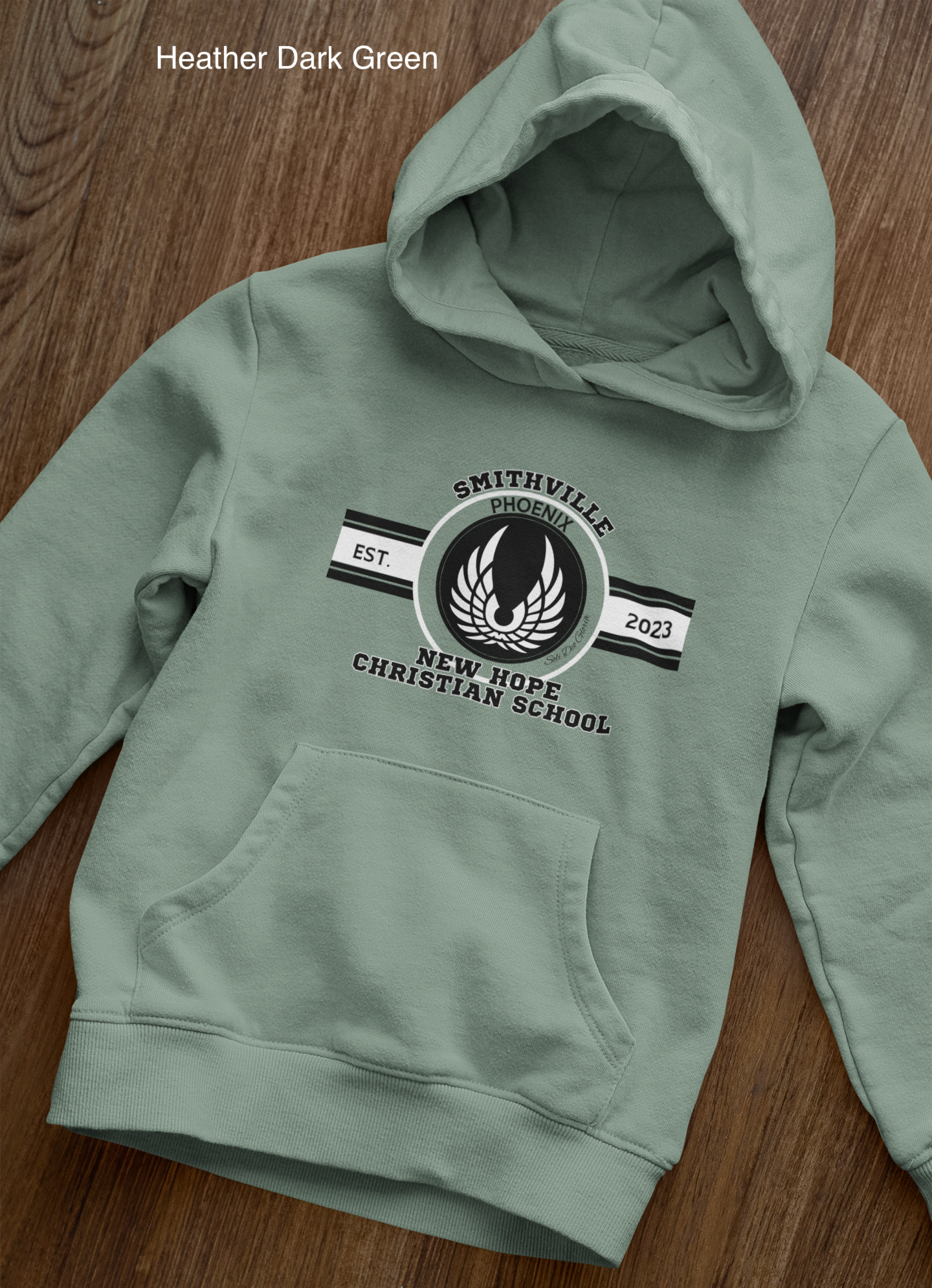 front-view-mockup-of-a-pullover-hoodie-laid-over-a-wooden-surface-33871 copy 28.png