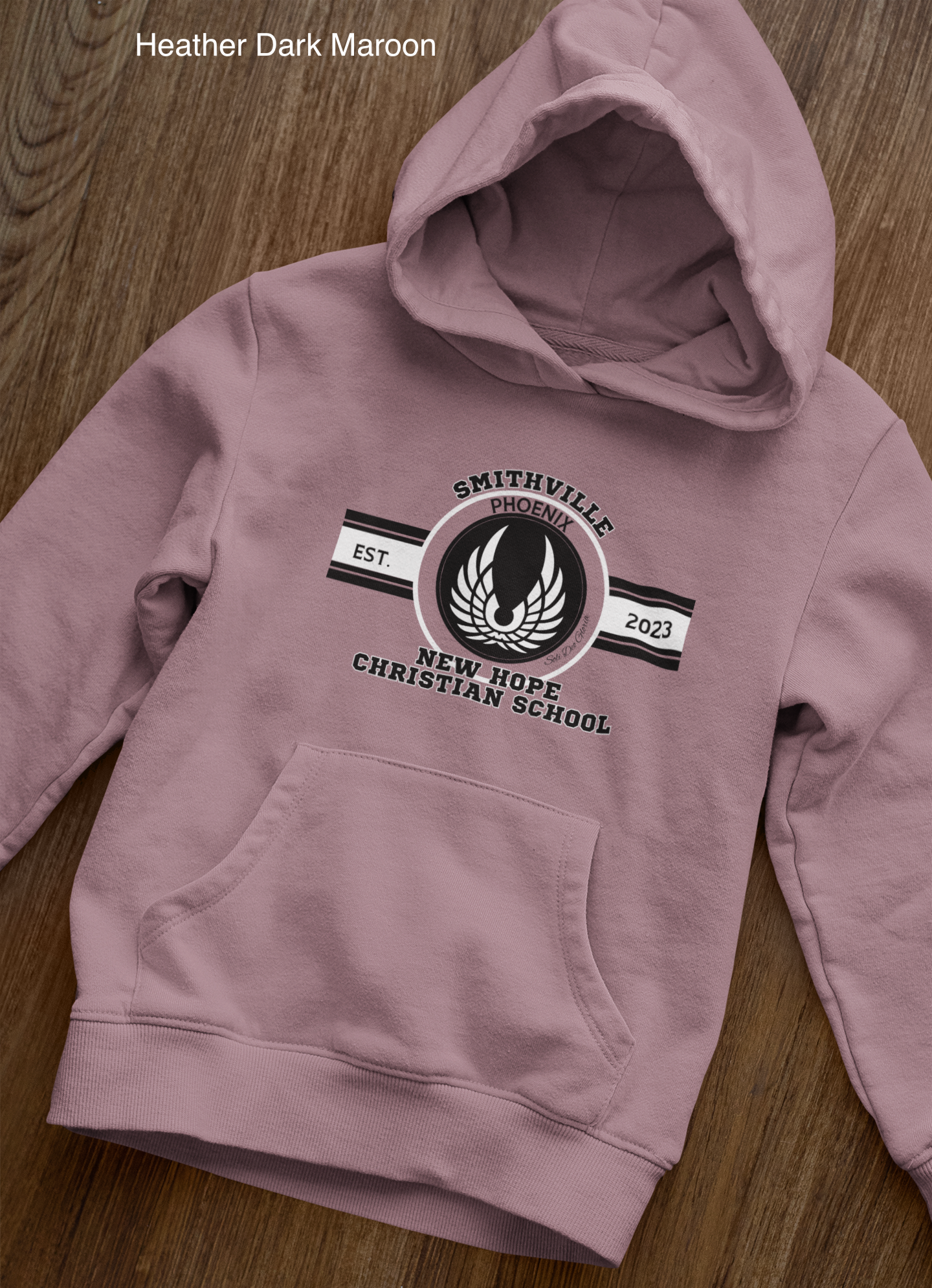 front-view-mockup-of-a-pullover-hoodie-laid-over-a-wooden-surface-33871 copy 27.png