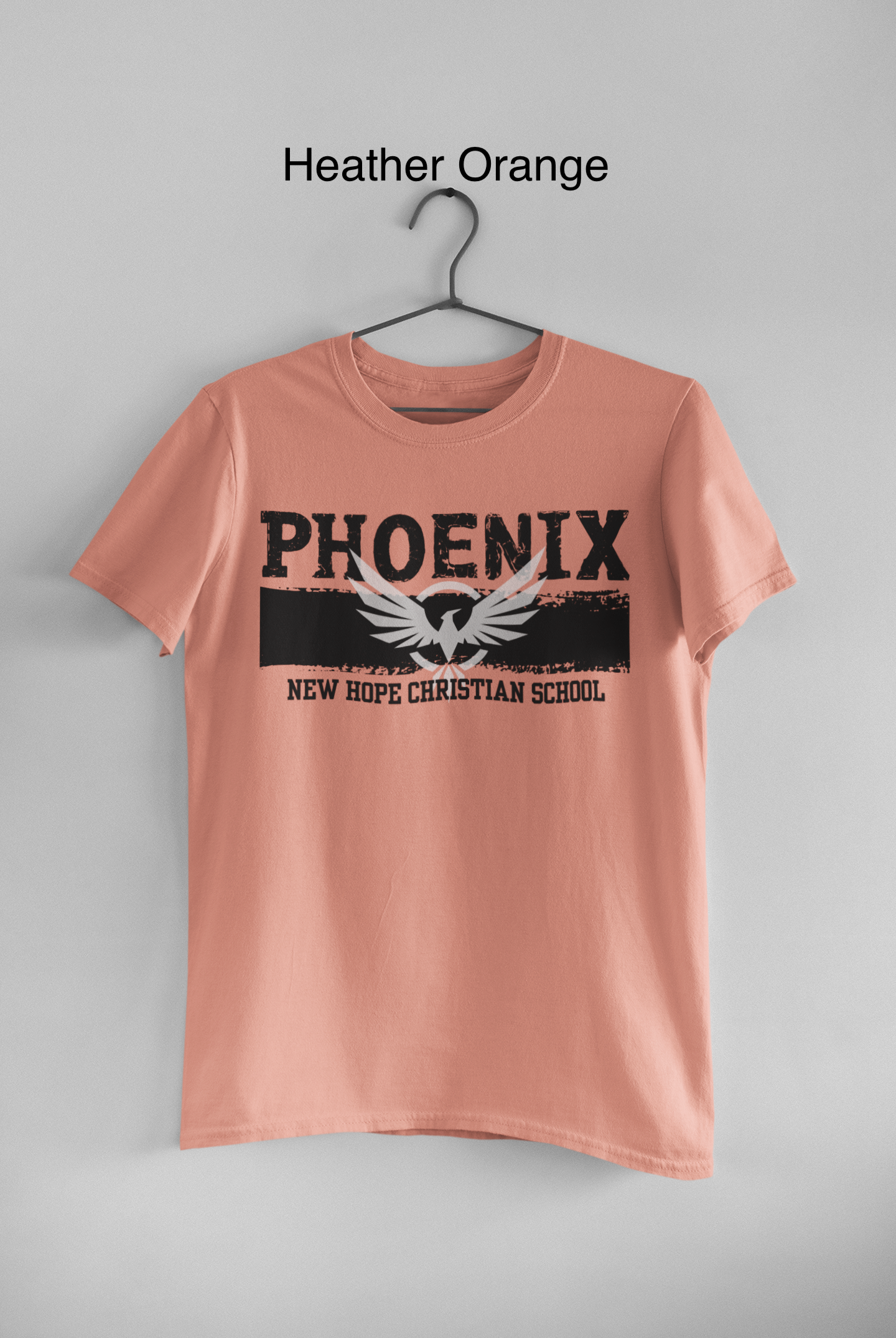 mockup-of-a-basic-round-neck-tee-hanging-on-a-wall-33734 copy.png