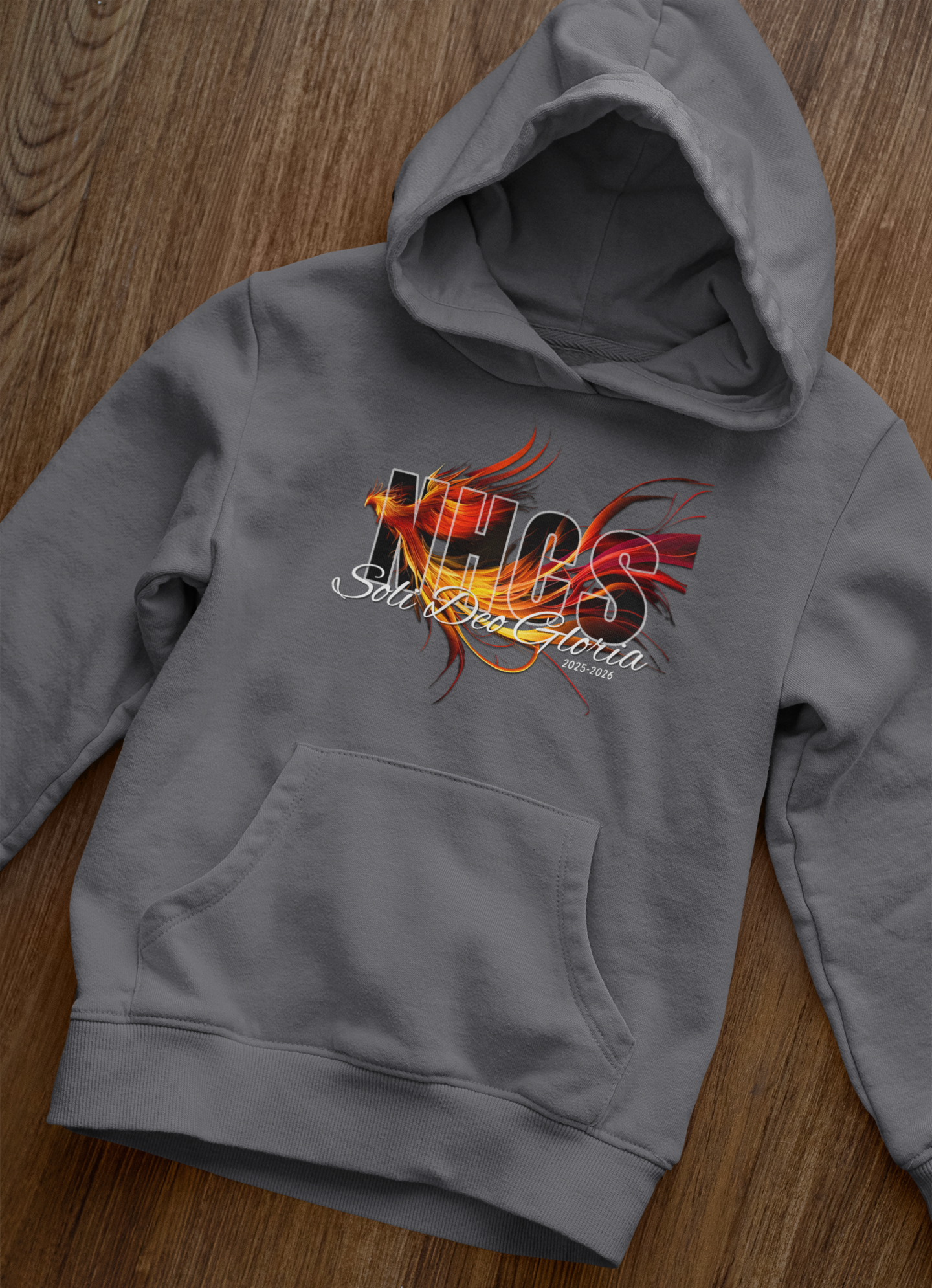 front-view-mockup-of-a-pullover-hoodie-laid-over-a-wooden-surface-33871.png