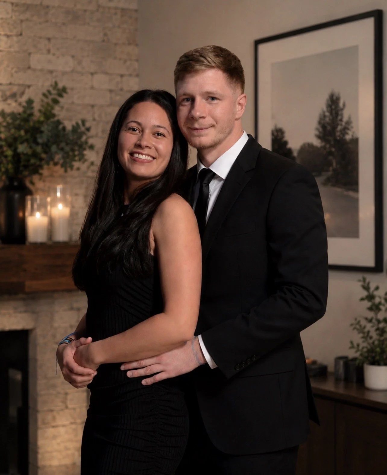 man and woman posing for picture in house