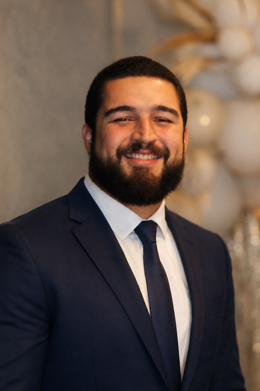 Daniel Angel Headshot in Navy Suit
