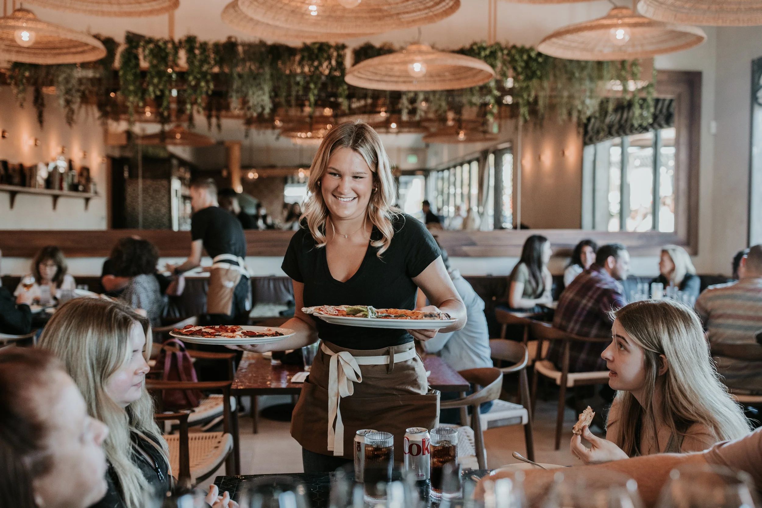 People getting pizza for Trivia Tuesday