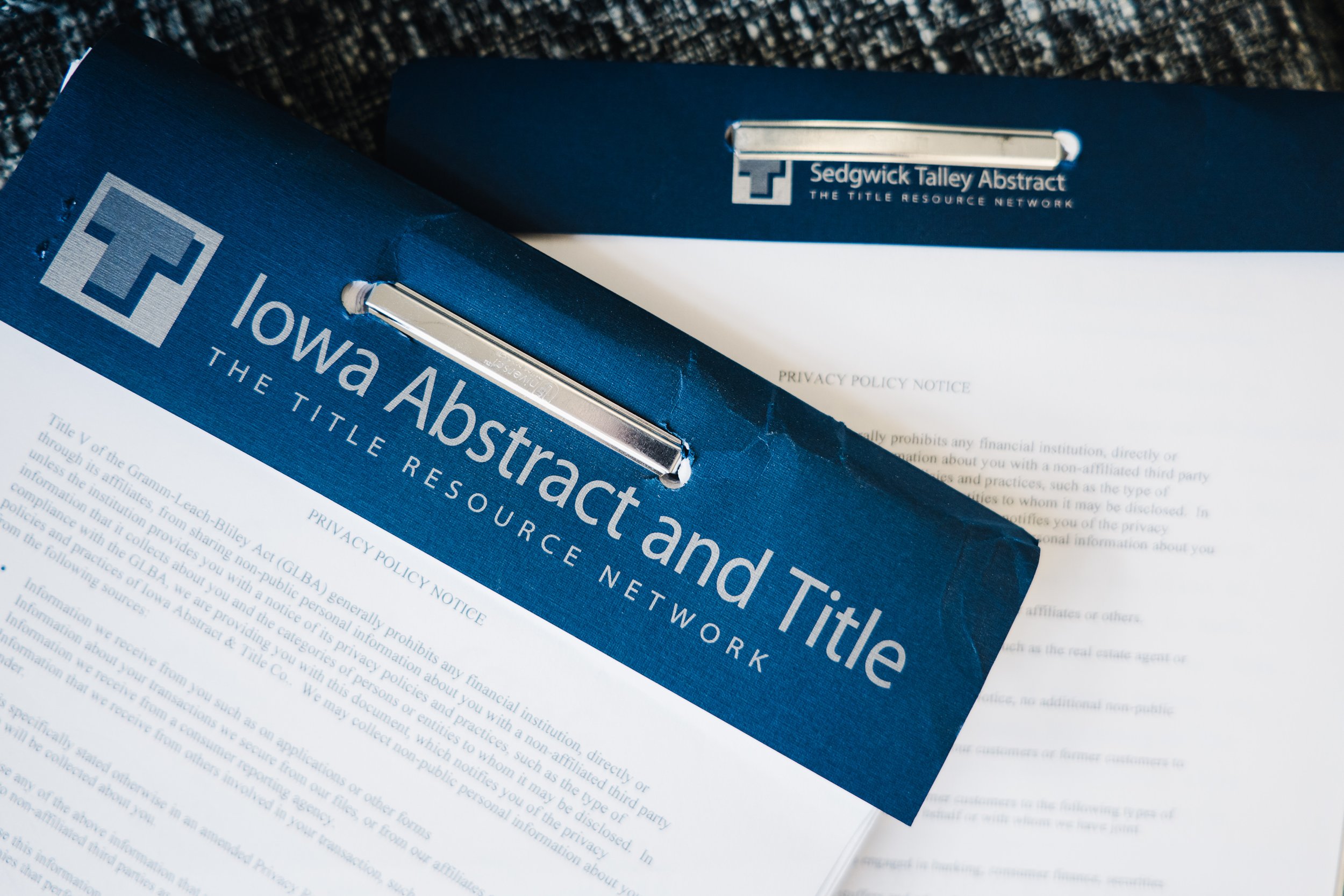A close up of the header of an Iowa abstract and title document by title resource network