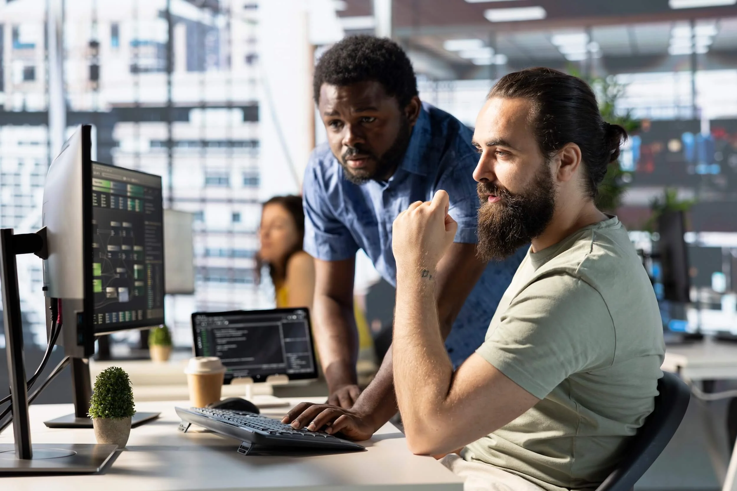 Workers Looking at Cybersecurity Alerts