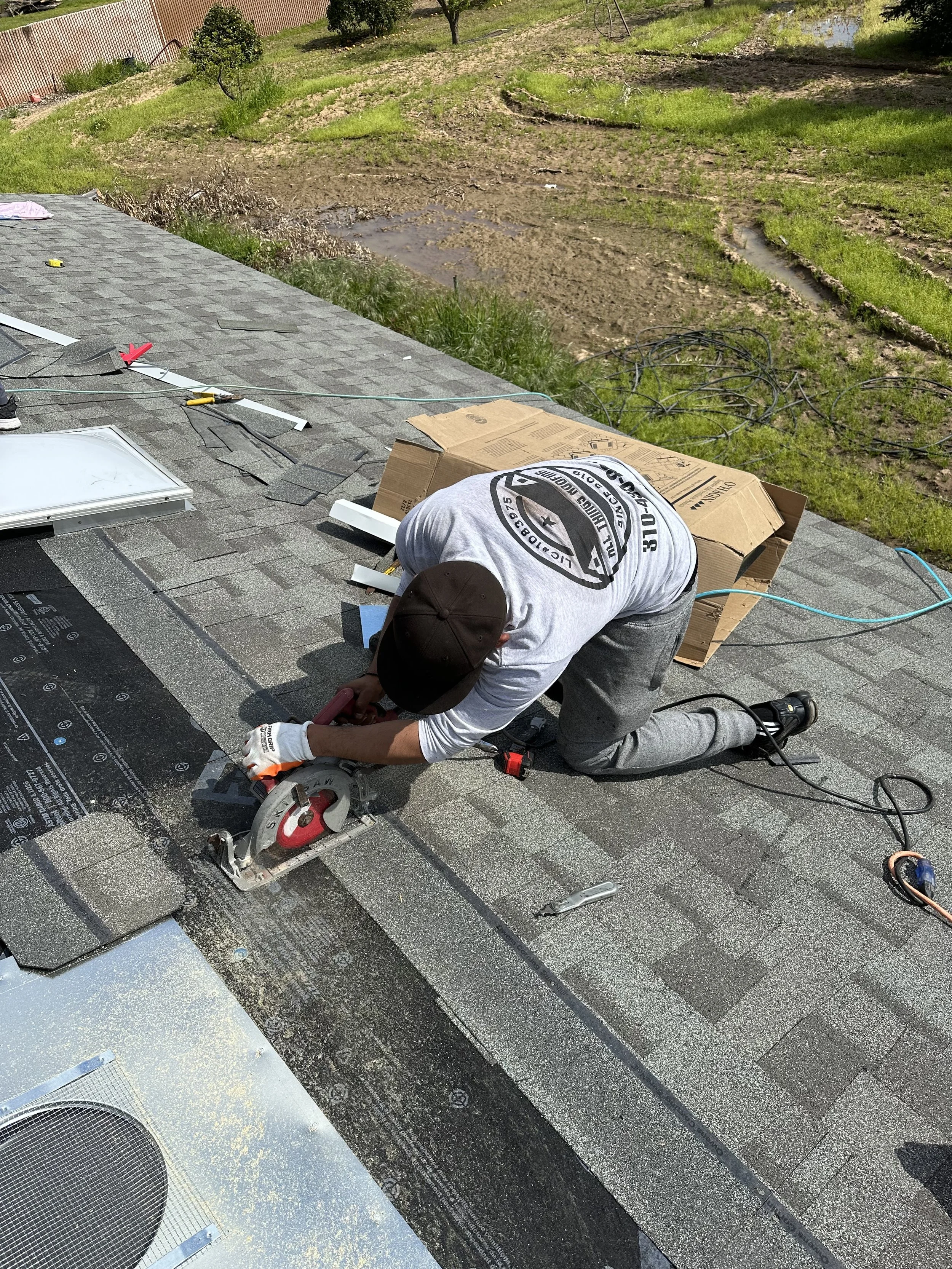 Oranssi technician working on a roof project