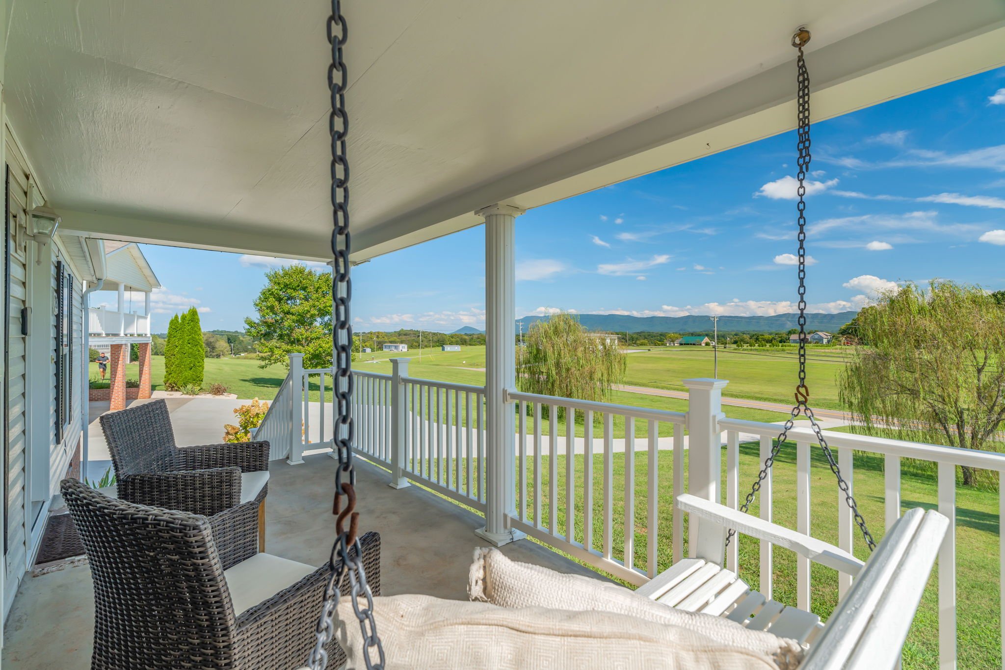 Relaxing porch swing with panoramic mountain views at this East Tennessee vacation home