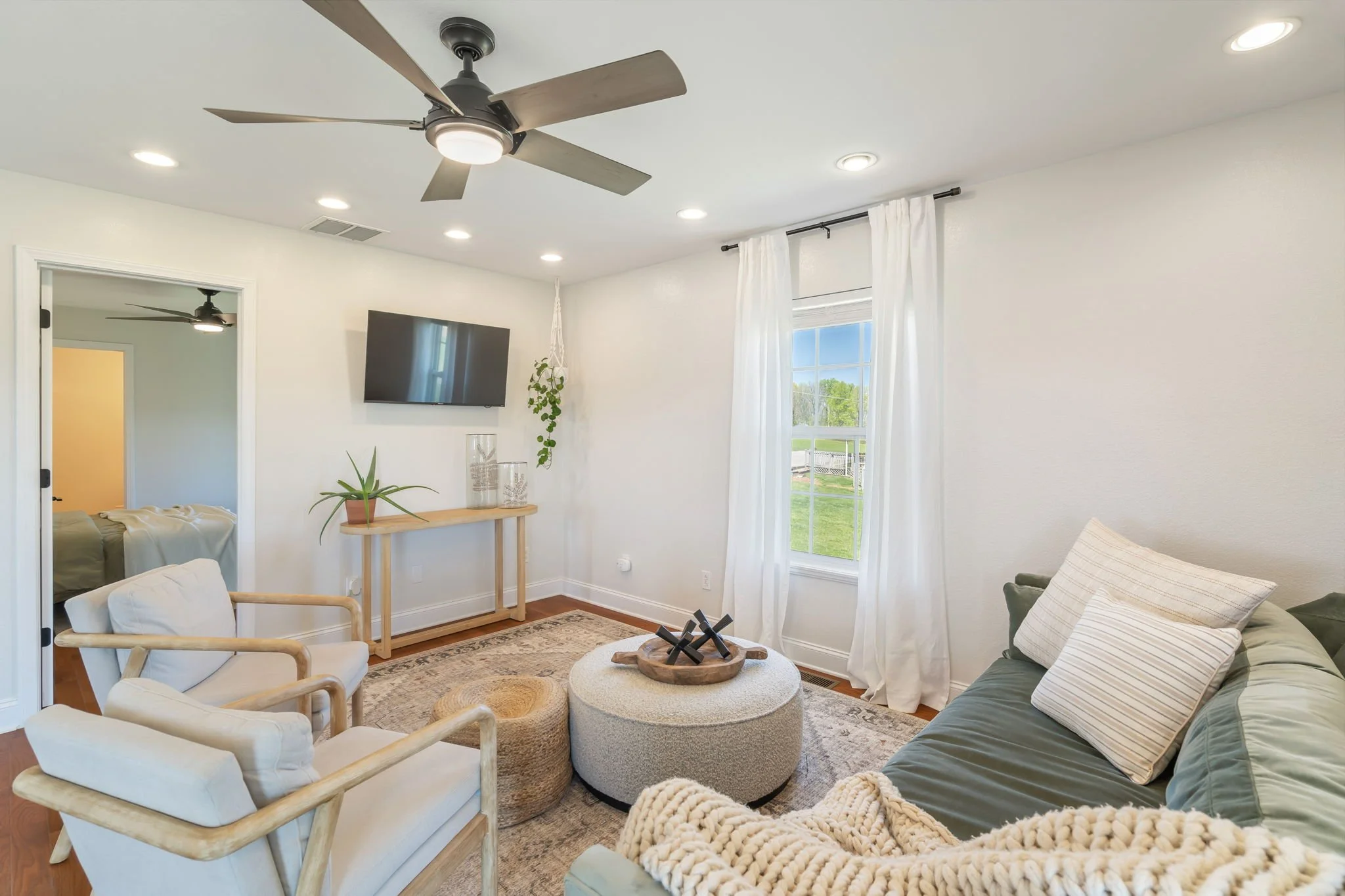 Open and bright living area with a view of the Smokies.