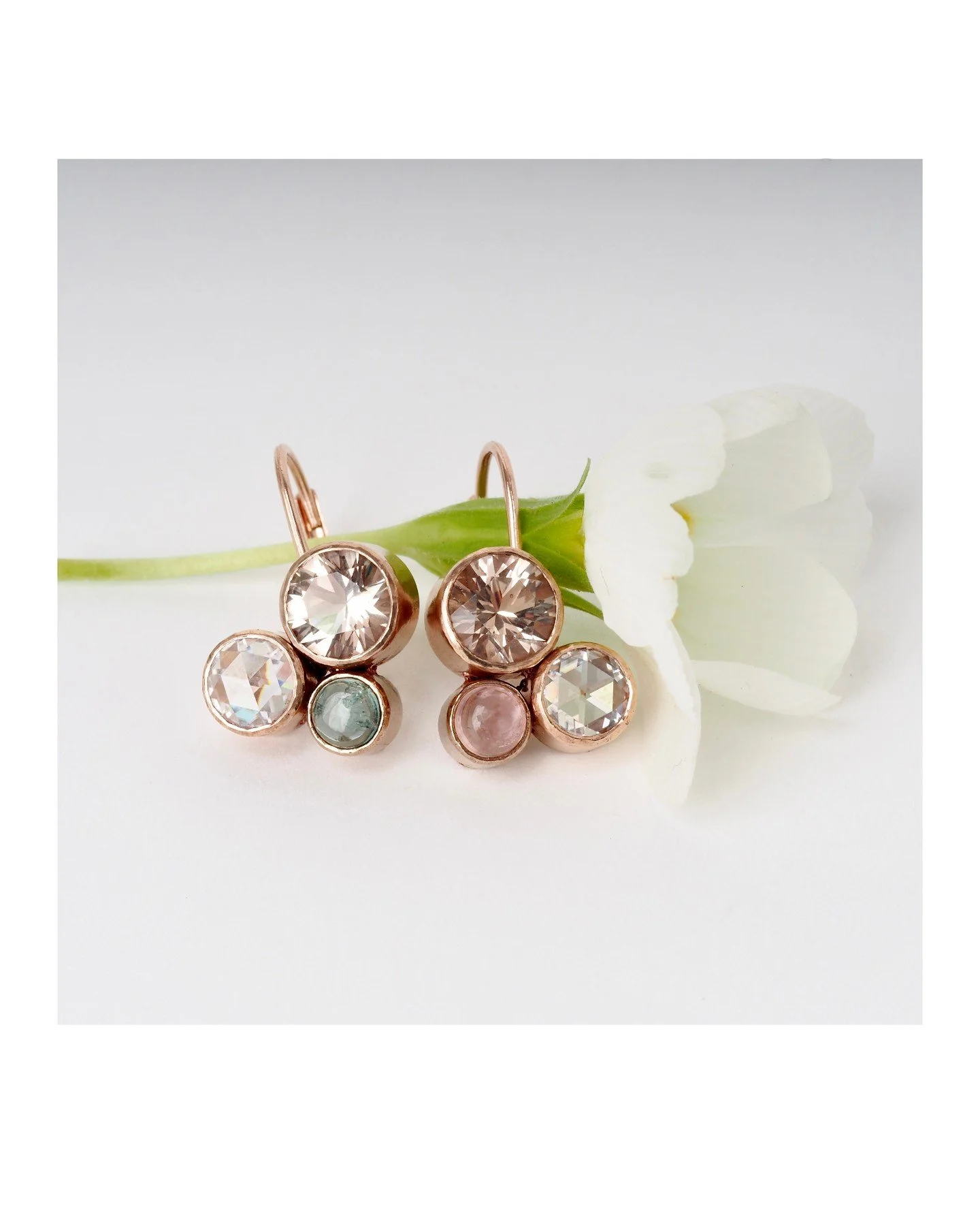 Spring Forward! Refreshing spring colors in these mismatch matching bespoke earrings. The pastel-hued stones are bezel set in recycled rose gold. Photographed with a pretty white primrose.

Sunday morning we'll be sprung forward in time whether we li