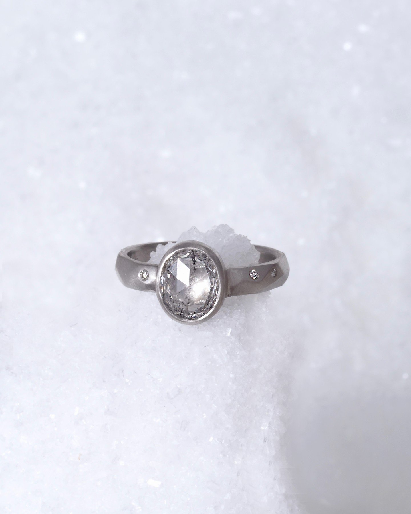 Feeling the Seattle snow with this incredible large diamond bezel set in recycled platinum. This is an @misfitdiamonds ethically-sourced stone of an impressive size. the band has a hand-formed texture for an organic feel and is embedded with tiny dia