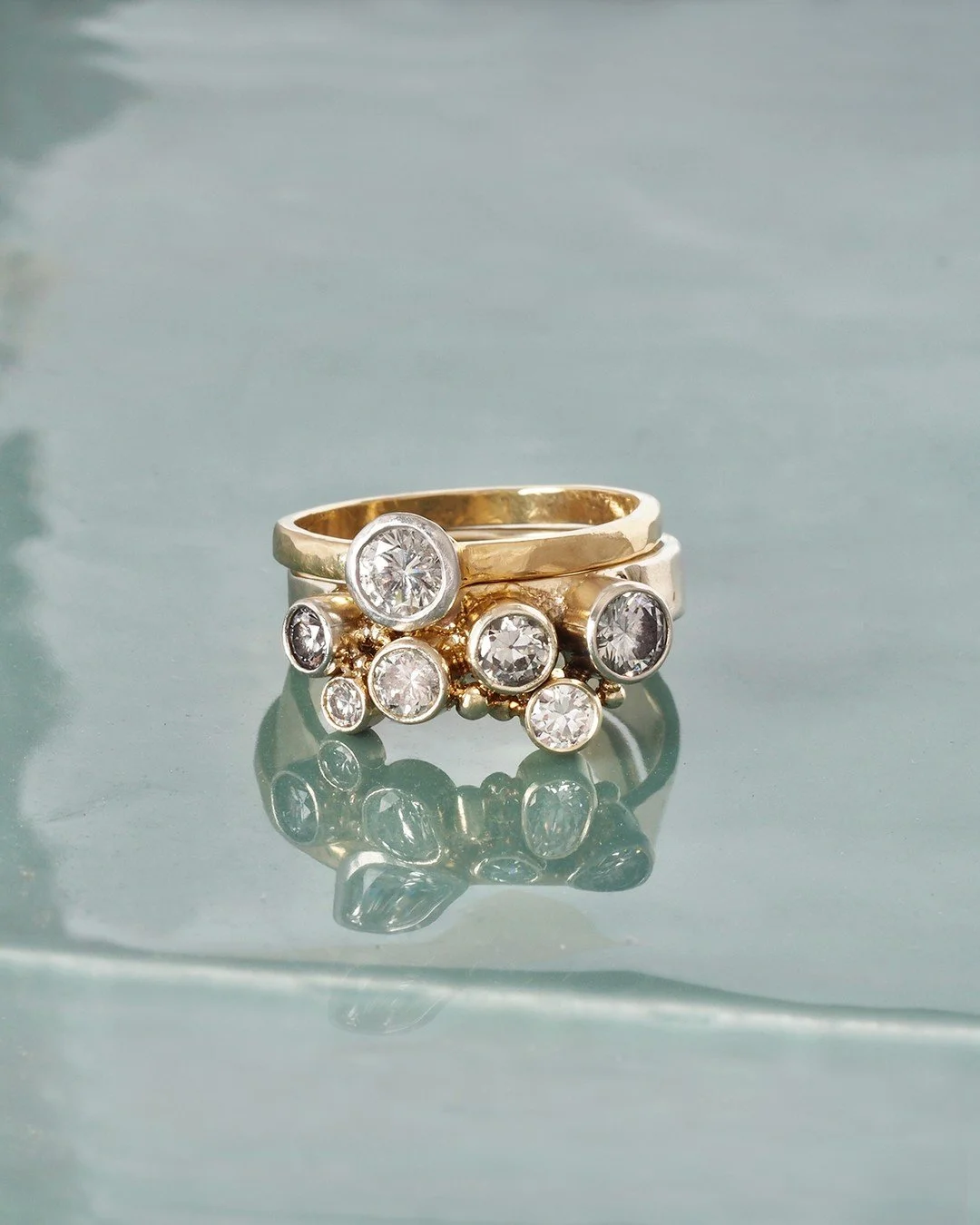 Laura's wedding ring set. It's engagement and wedding ring season and we are booking some wonderful projects wholly designed for the individual. For this ring, Laura wanted some gold messiness around the bezel, so Sally added molten gold to create th