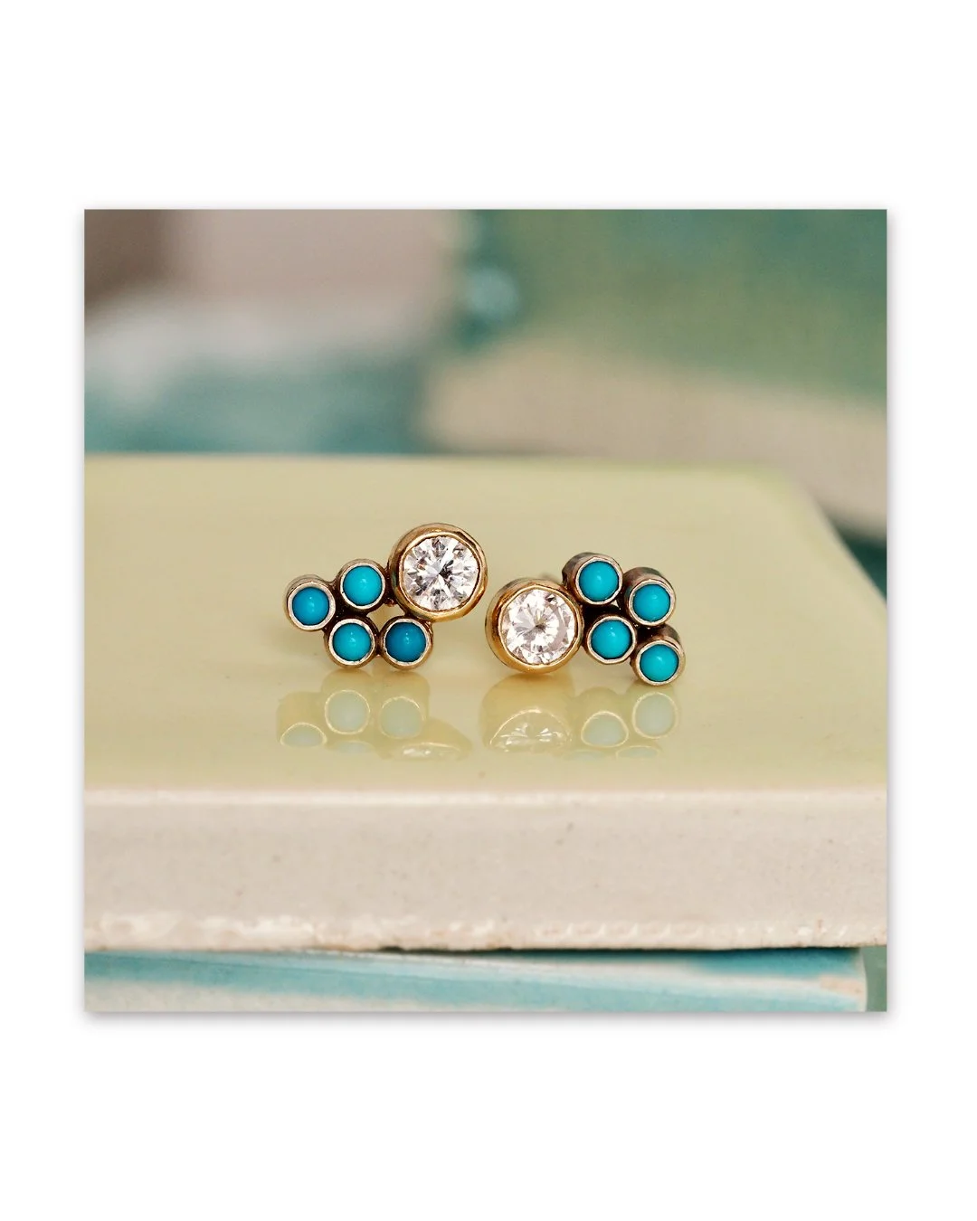 Diamonds and turquoise cabochon stud earrings bezel set in recycled 14K gold. They match in our perfectly imperfect way. 

This set can be made with a variety of little cabochon stones to match birthstones, favorite colors, or even a rainbow of hues.
