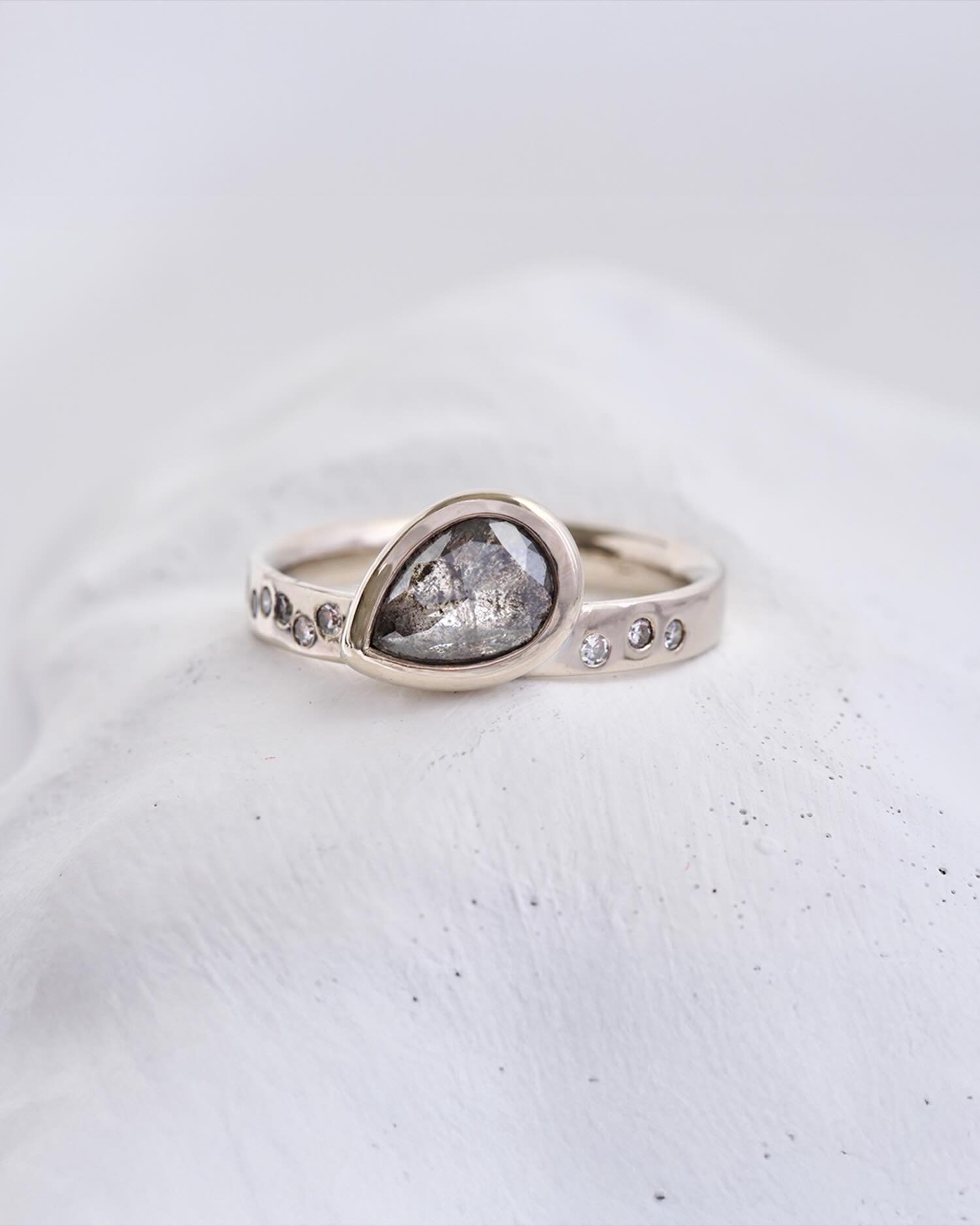 Paisley salt and pepper diamond sprinkled with salt and pepper round diamonds in the band. The band is recycled platinum for a delicious richness in tone. This one is bespoken for, but we can make one for you too&hellip; not exactly the same, as no t