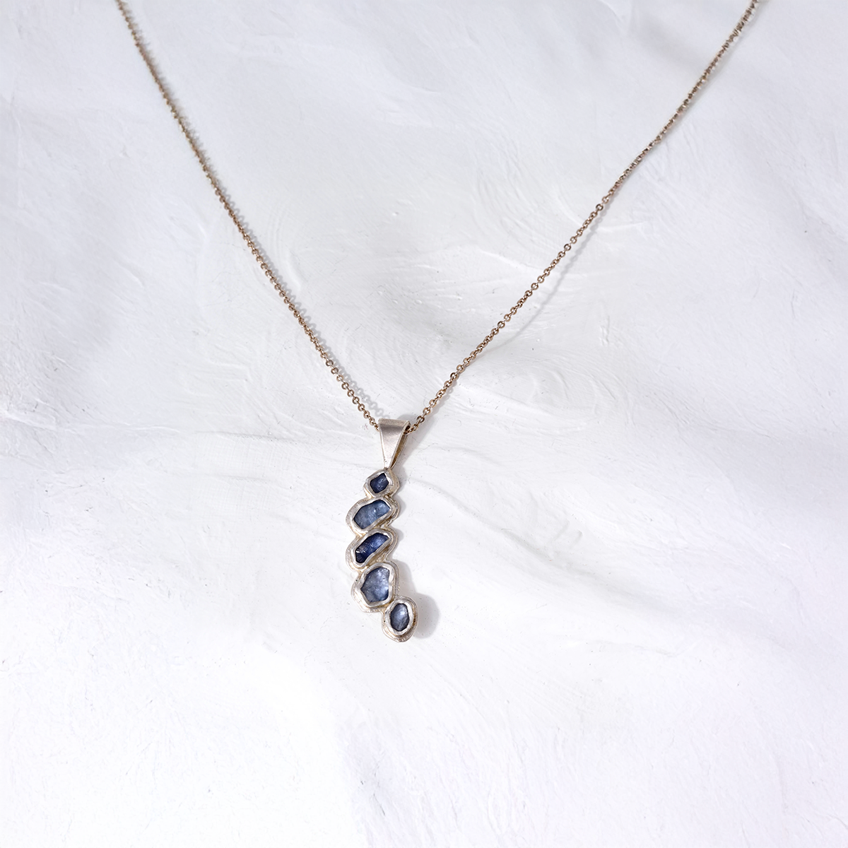 Mira blue pendant.png