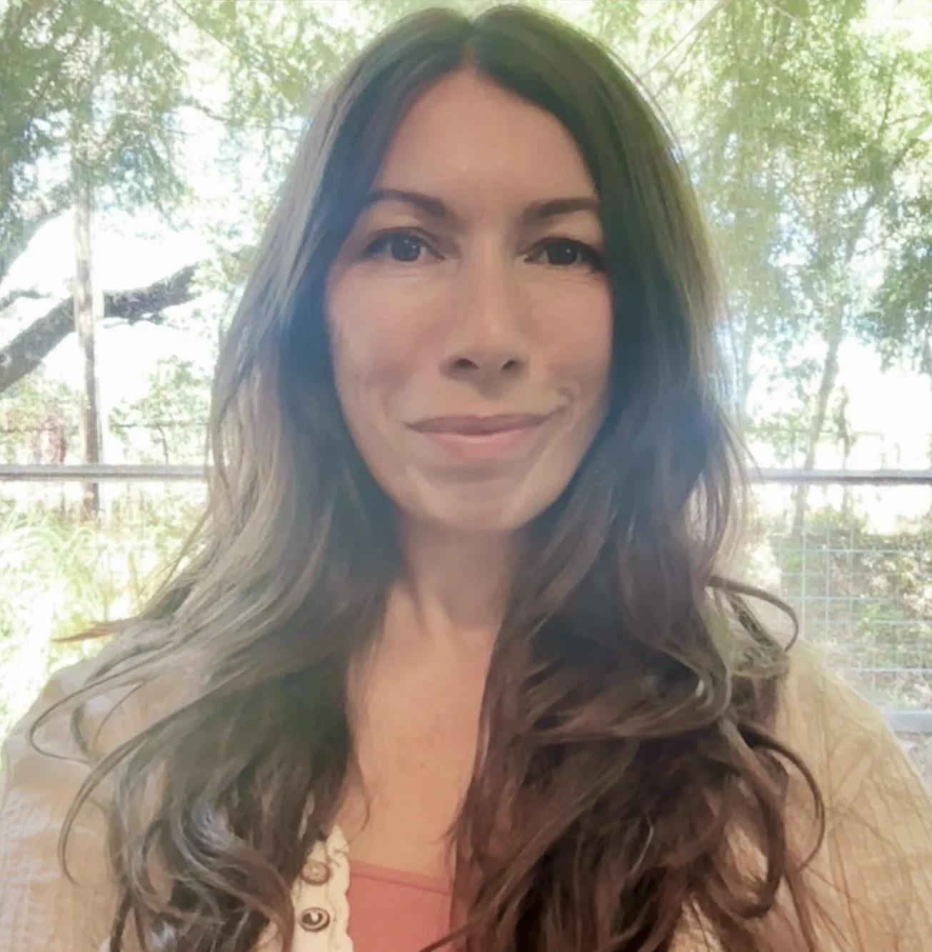 white woman in front of window