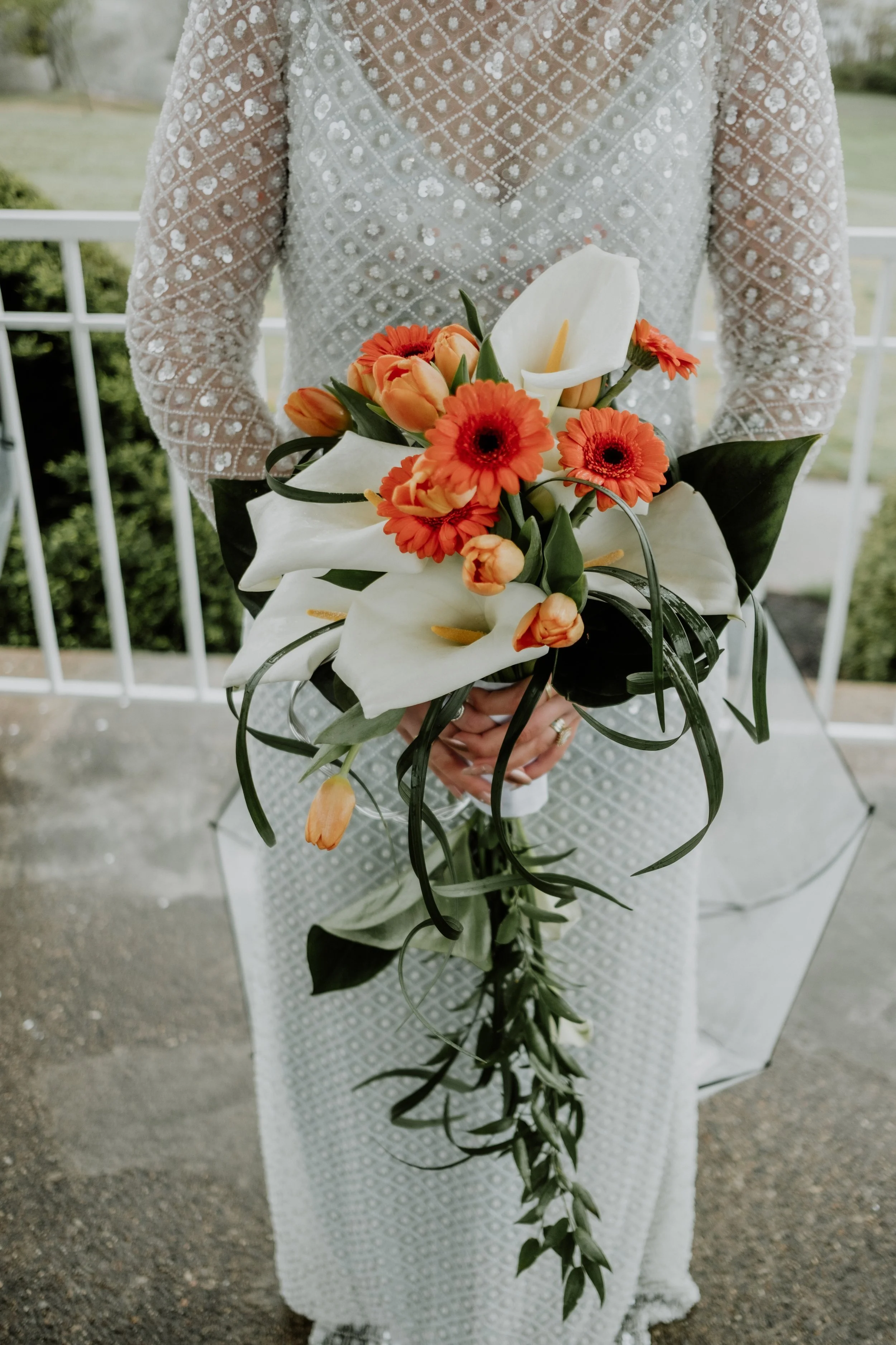 My bridal bouquet was a collaboration between myself and our florist, Bert Ford. I showed him my vision and he brought it to life. I wanted a handle built into my bouquet so I could easily carry it around throughout the day, and he delivered with a b