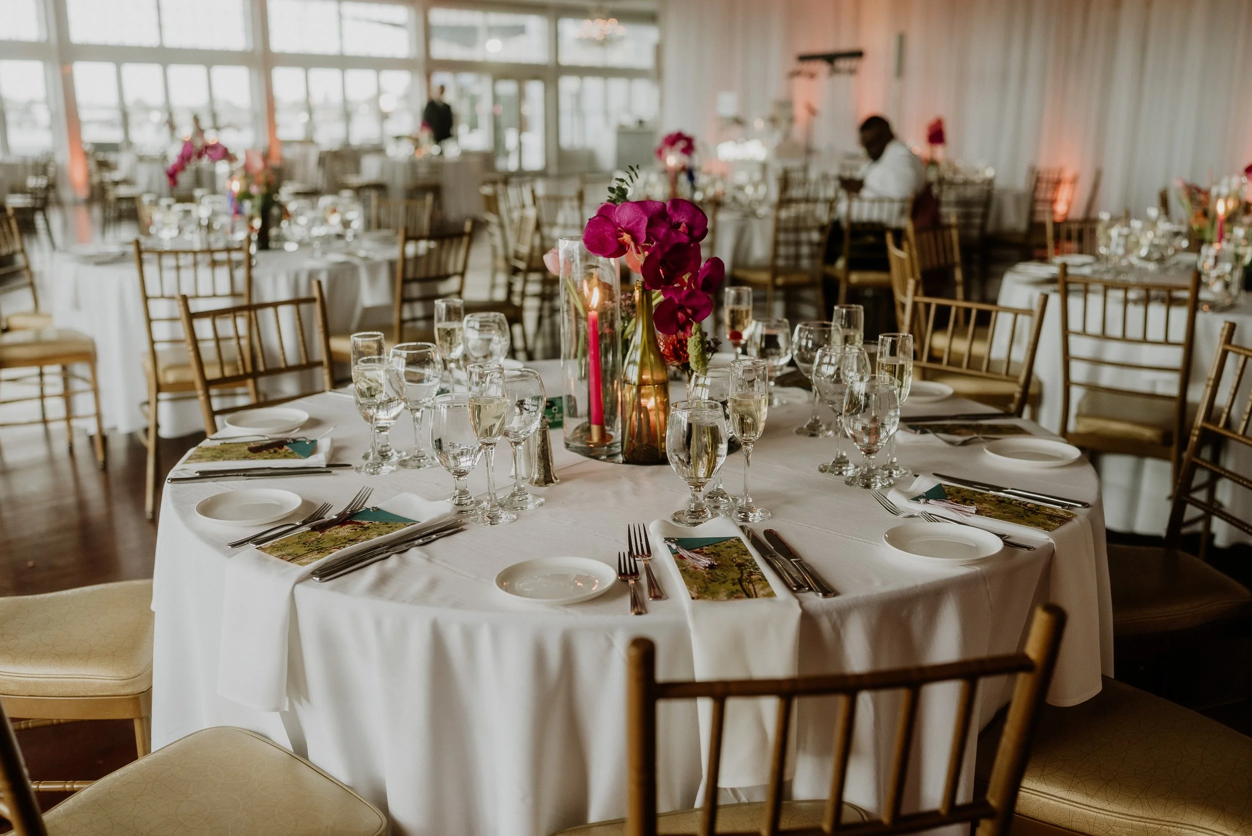 All of the glass used at the ceremony was recycled over the 18 months of wedding planning. Hannah's family all came together one night to spend hours cutting, sanding and cleaning bottles to be repurposed into the beautiful glassware you saw on the t