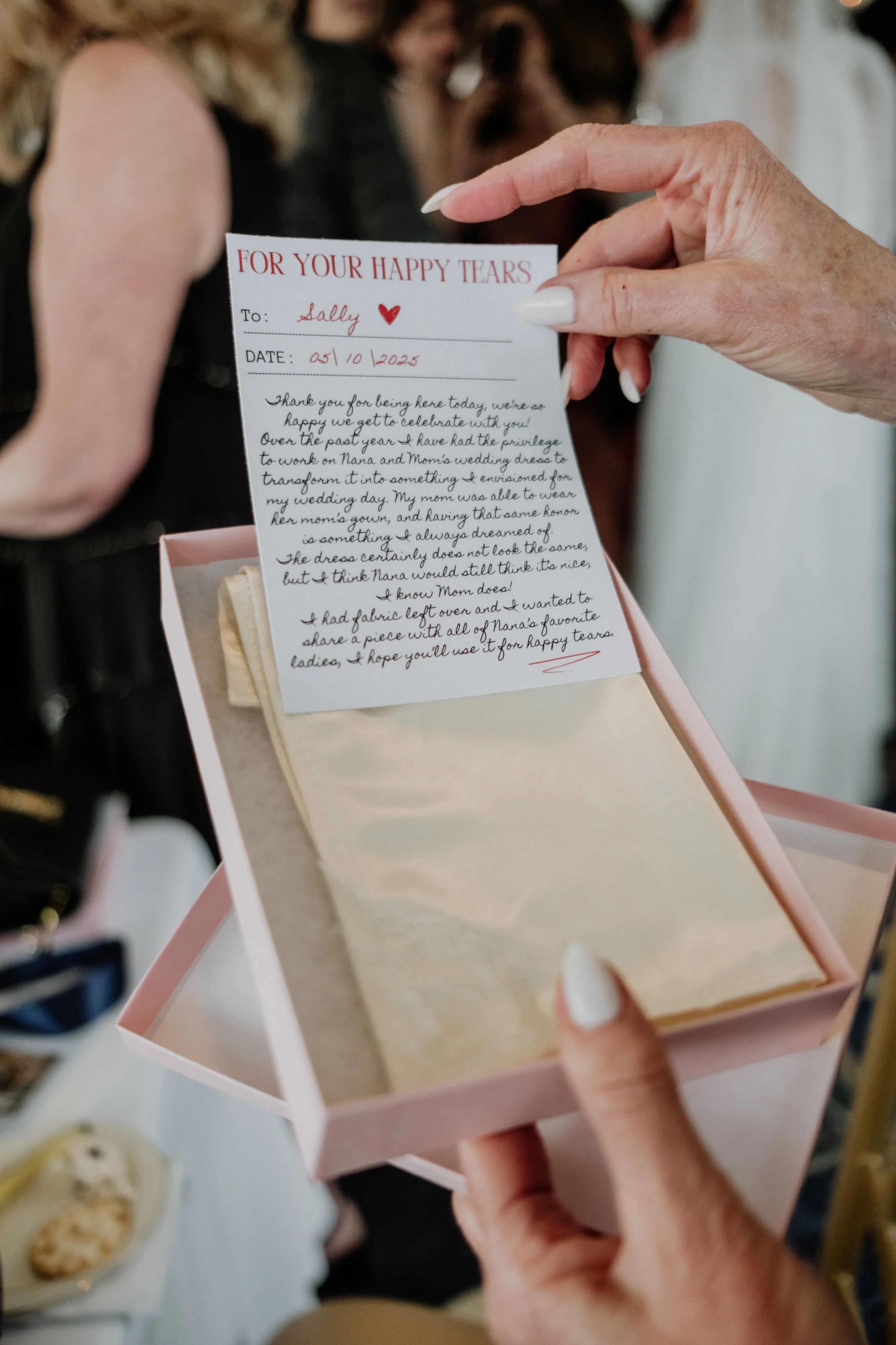 Hannah created nearly a dozen hand sewn handkerchiefs out of remnant wedding dress fabric. The fabric was remnant of her mother and grandmother's wedding dress.
They were handed out to all the women in her family at the wedding ceremony.