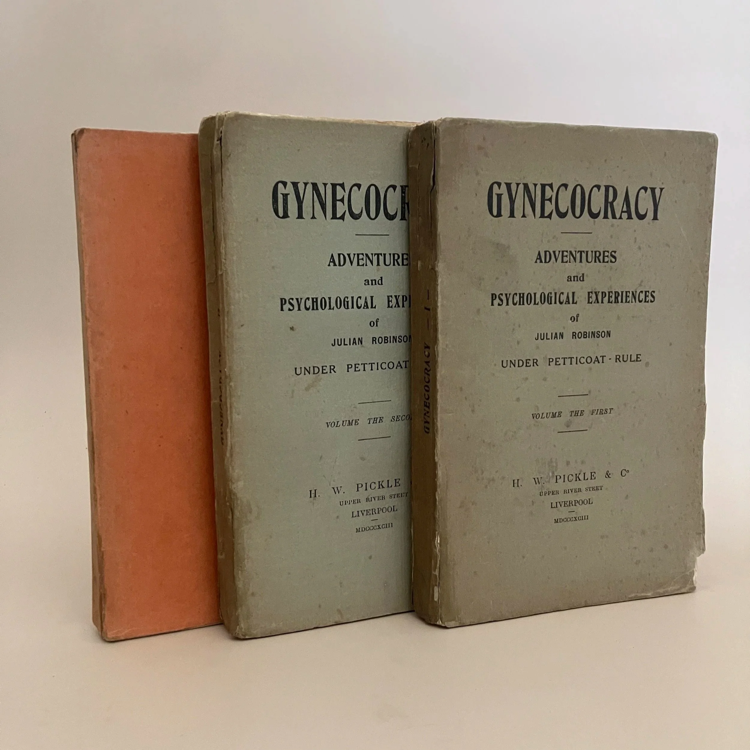 Three 19th century books in paper wrappers with the title Gynecocracy