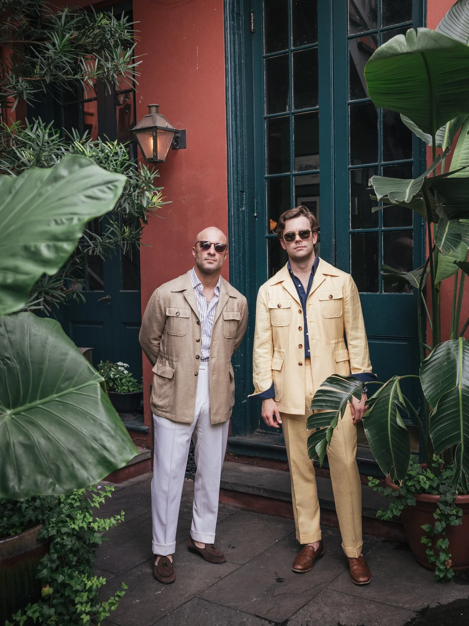 Sonny's safari jacket is Gladson bamboo, with cuffed white wool trousers, striped stretch cotton shirt. James his safari jacket with their matching trousers and a linen shirt.