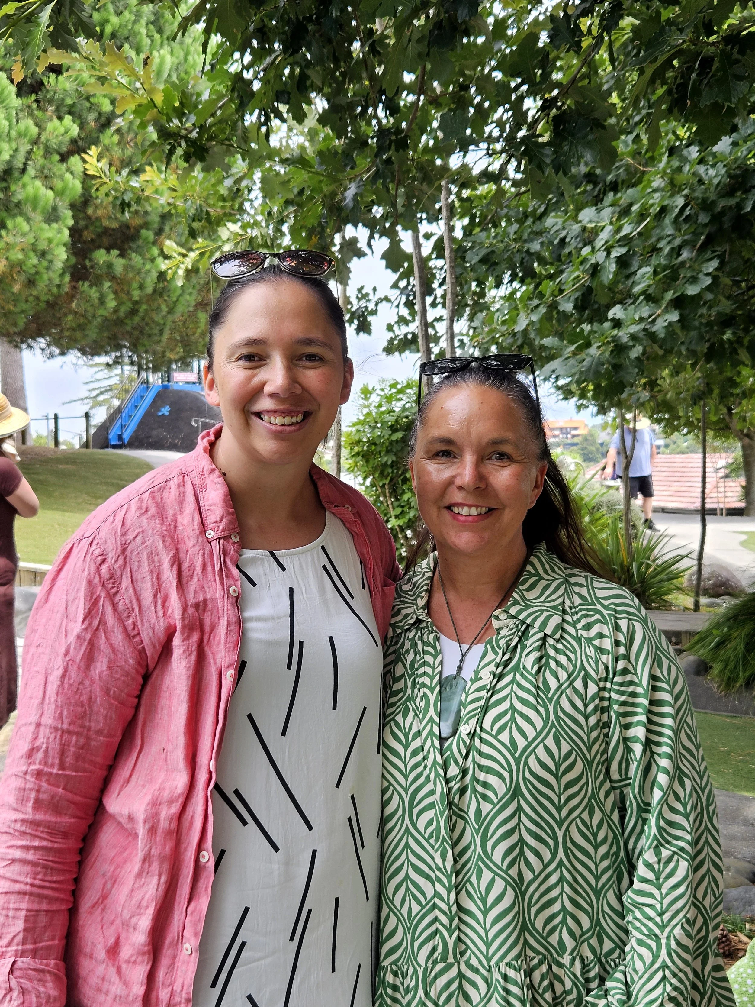 A close up photo of two wāhine Māori at a park