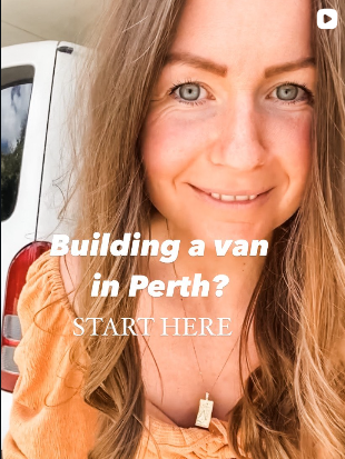 Close-up of a smiling woman with long light brown hair and blue eyes, standing outdoors.