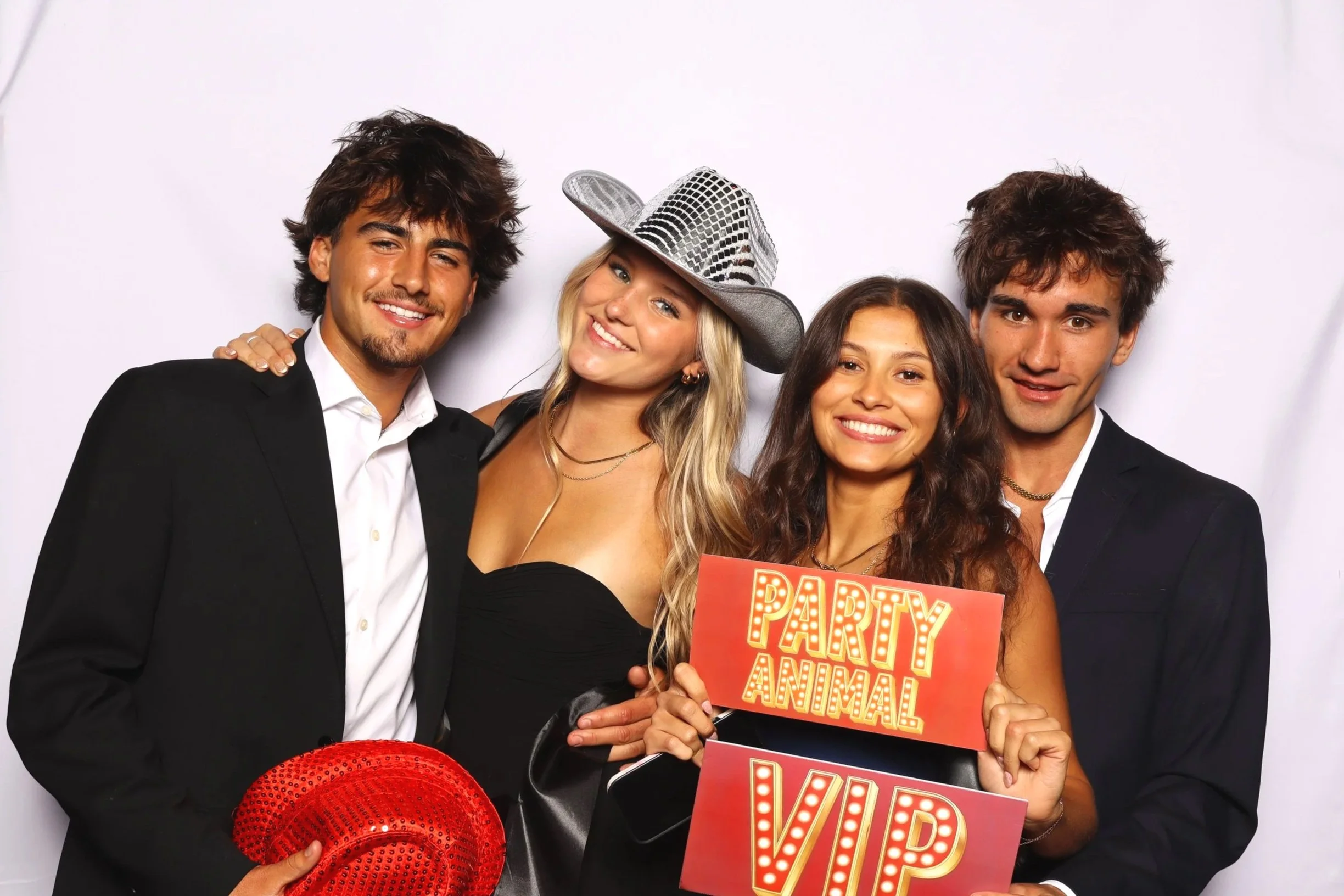 Young group posing at photo booth rental event in Orlando, FL — D&amp;L Photobooths