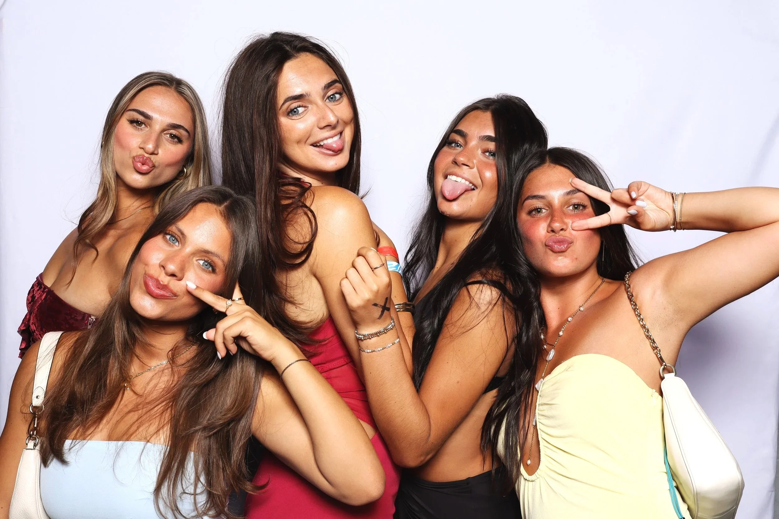 Friends smiling at photo booth rental event in Orlando, FL— D&amp;L Photobooths
