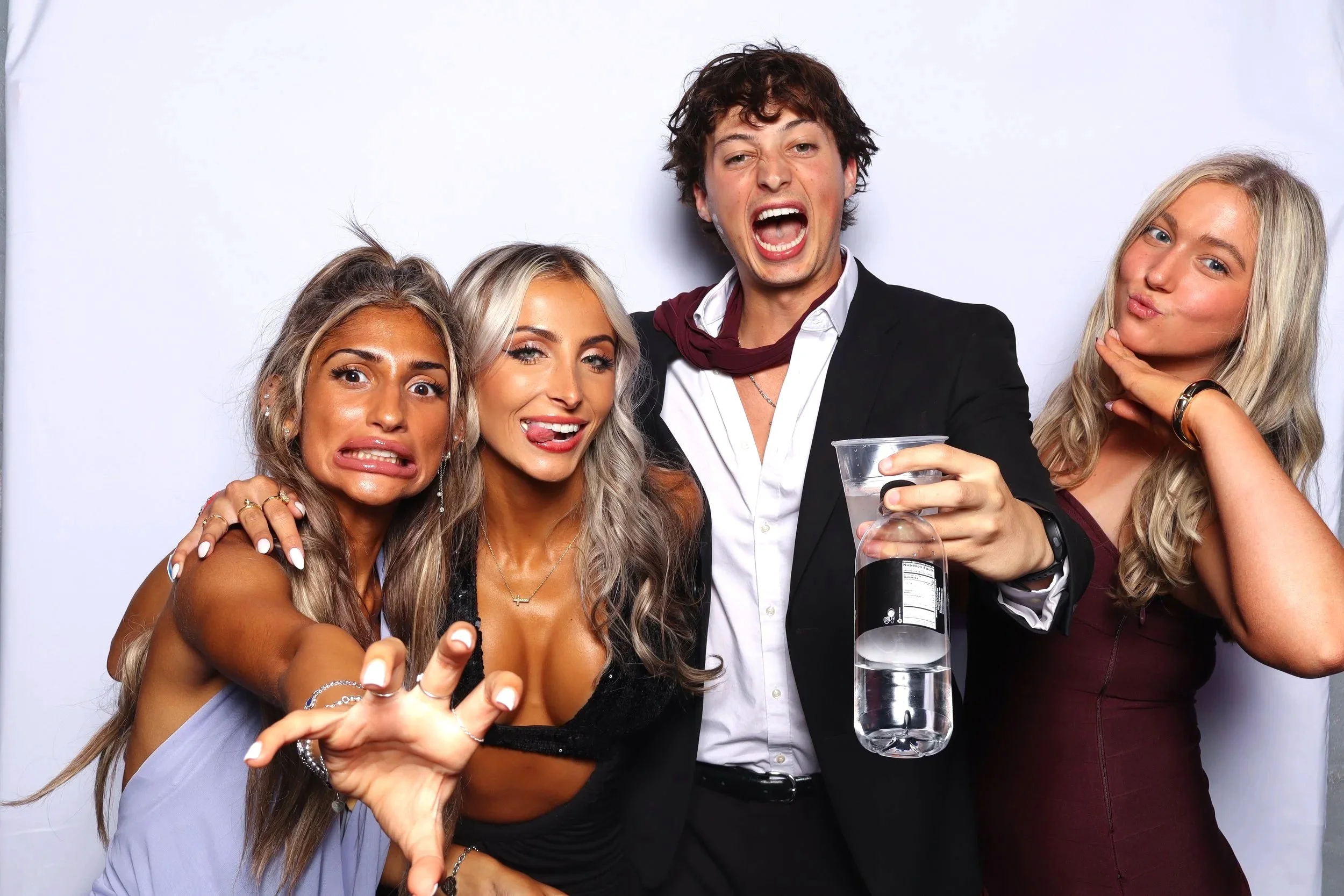 Group of friends enjoying photo booth rental at party in Orlando, FL — D&amp;L Photobooths