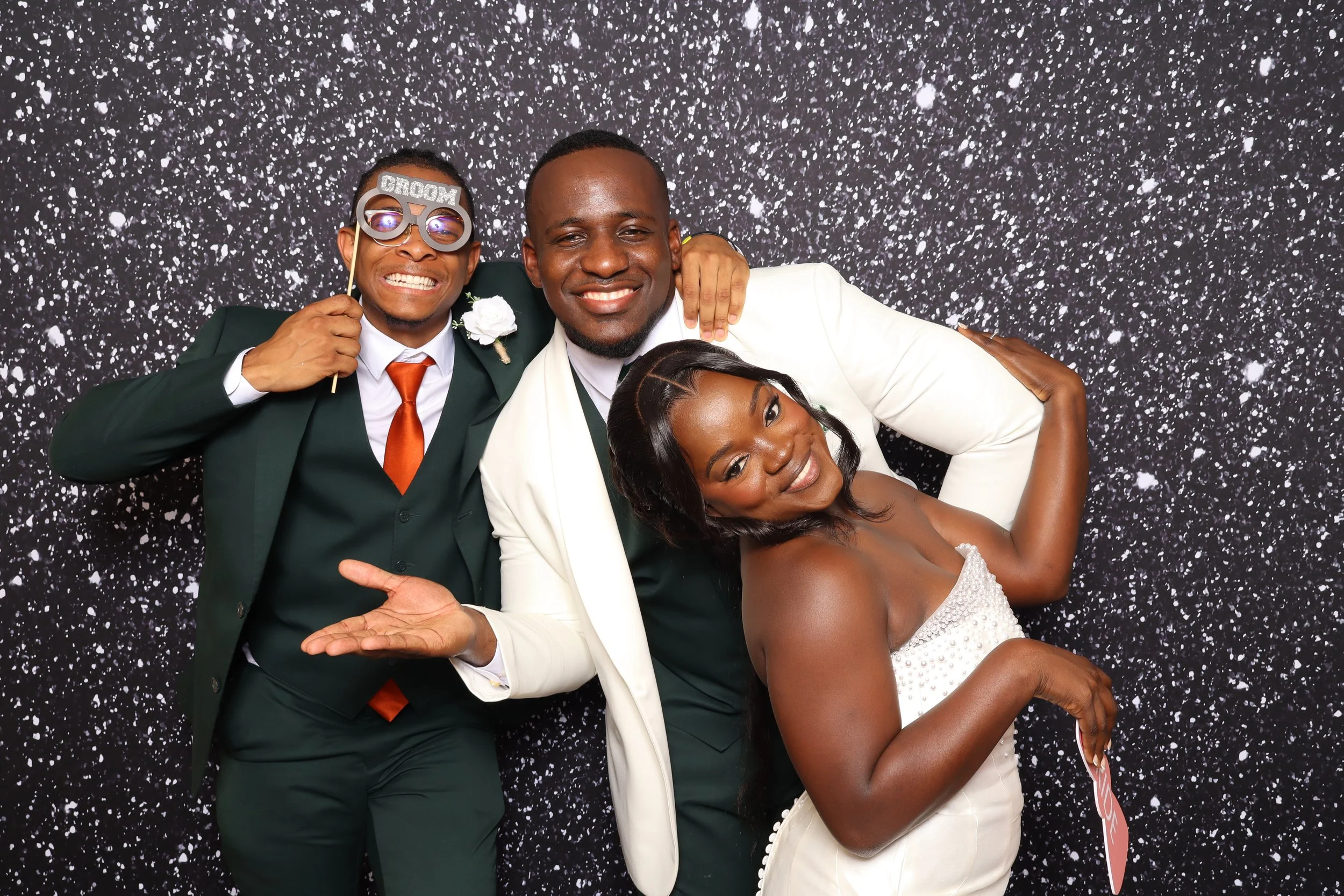 Best man, Groom and Bride posing at a black glitter photo booth backdrop at photo booth Fort Lauderdale, FL — D&amp;L Photobooths 