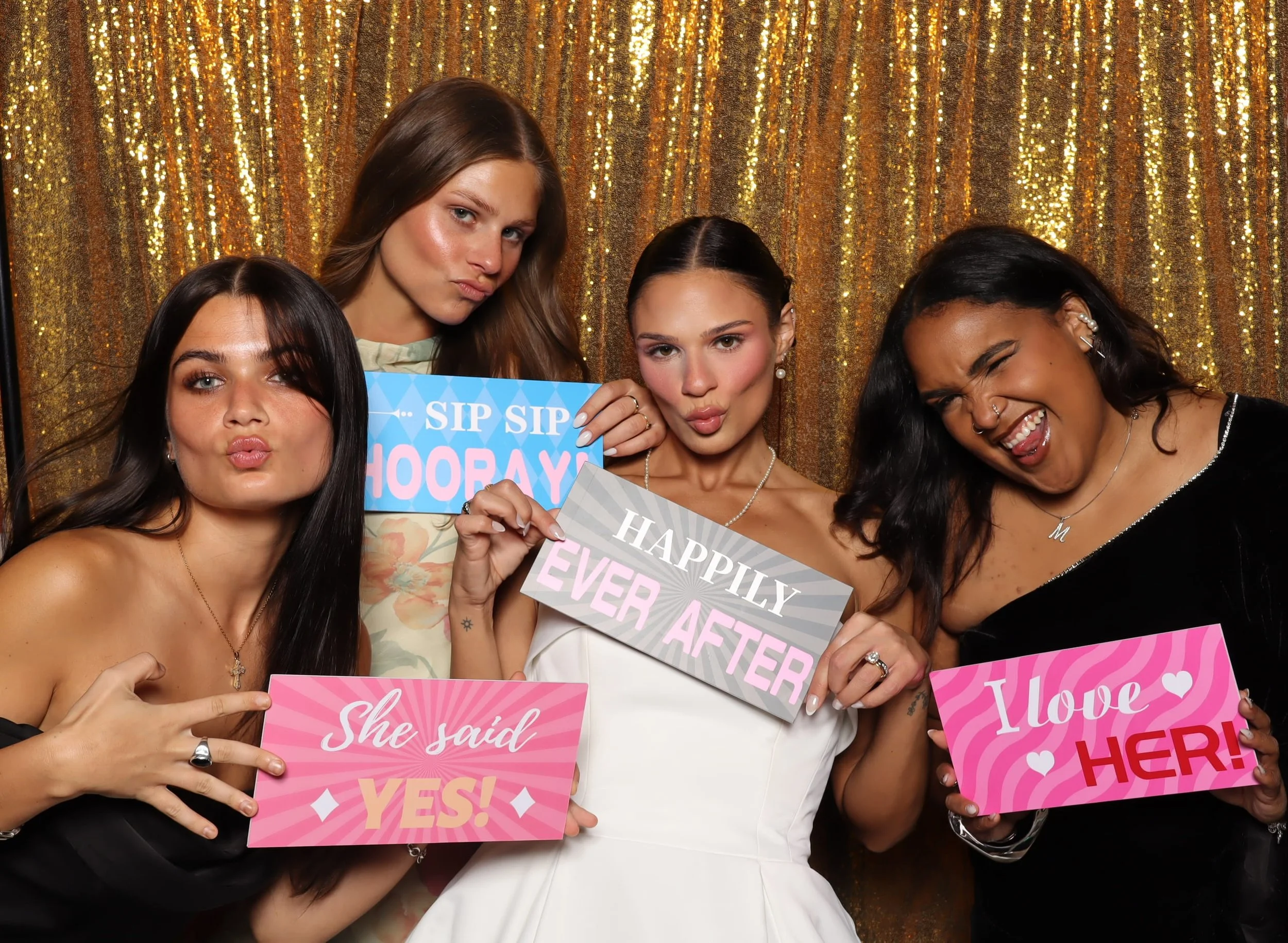 Wedding guests with She Said Yes signs at photo booth rental in Orlando, FL — D&amp;L Photobooths