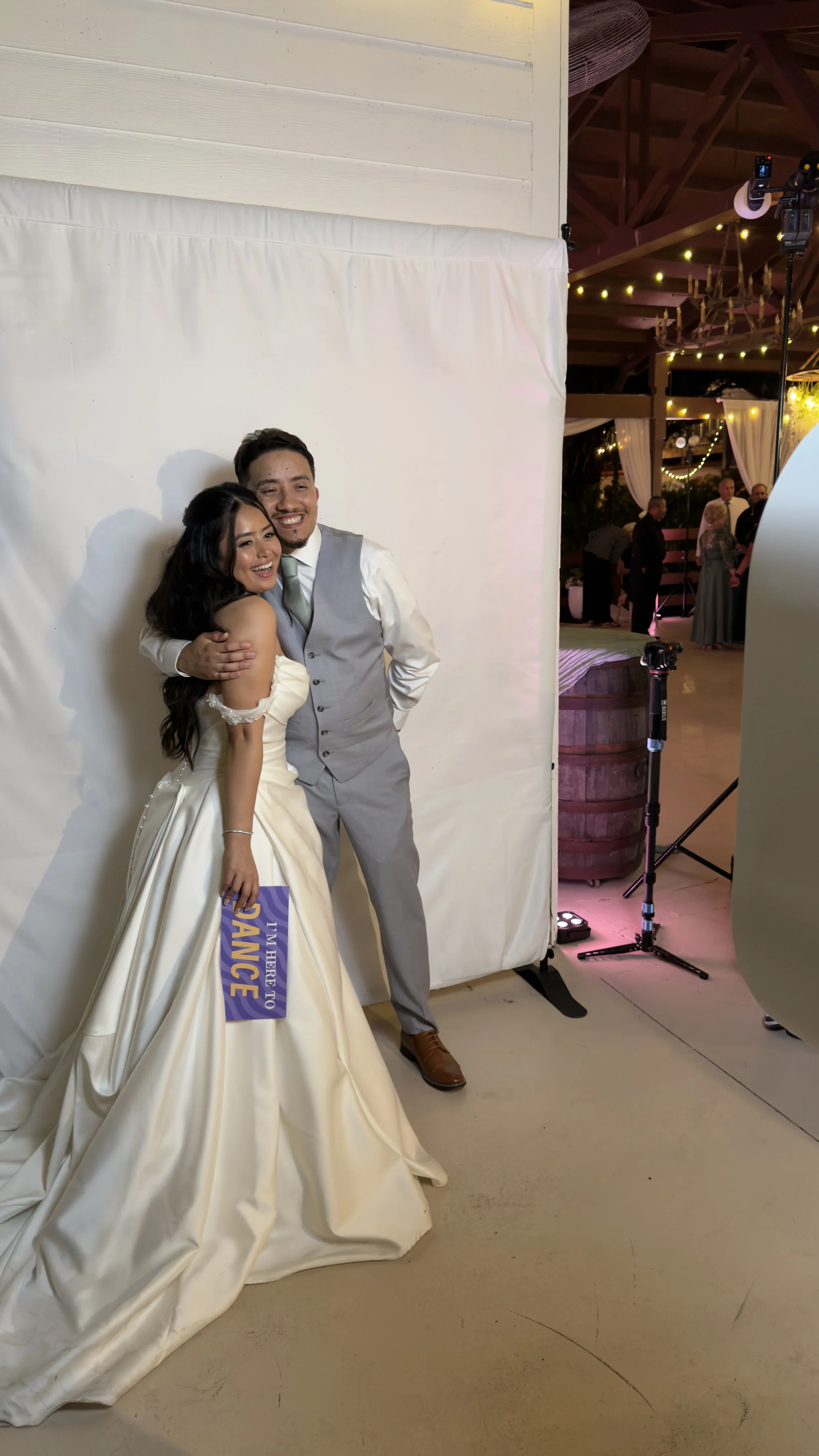 Wedding couple at photo booth rental setup in Vero Beach, FL — D&L Photobooths