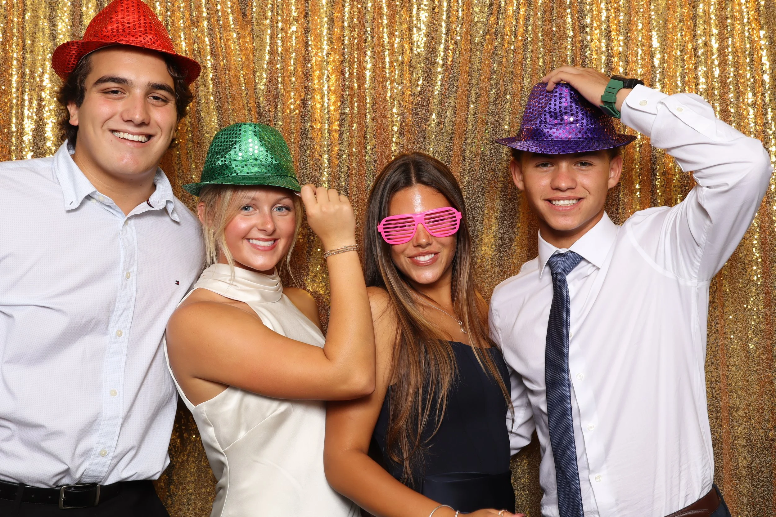Group of friends enjoying photo booth rental at prom party in Port St. Lucie, FL — D&amp;L Photobooths