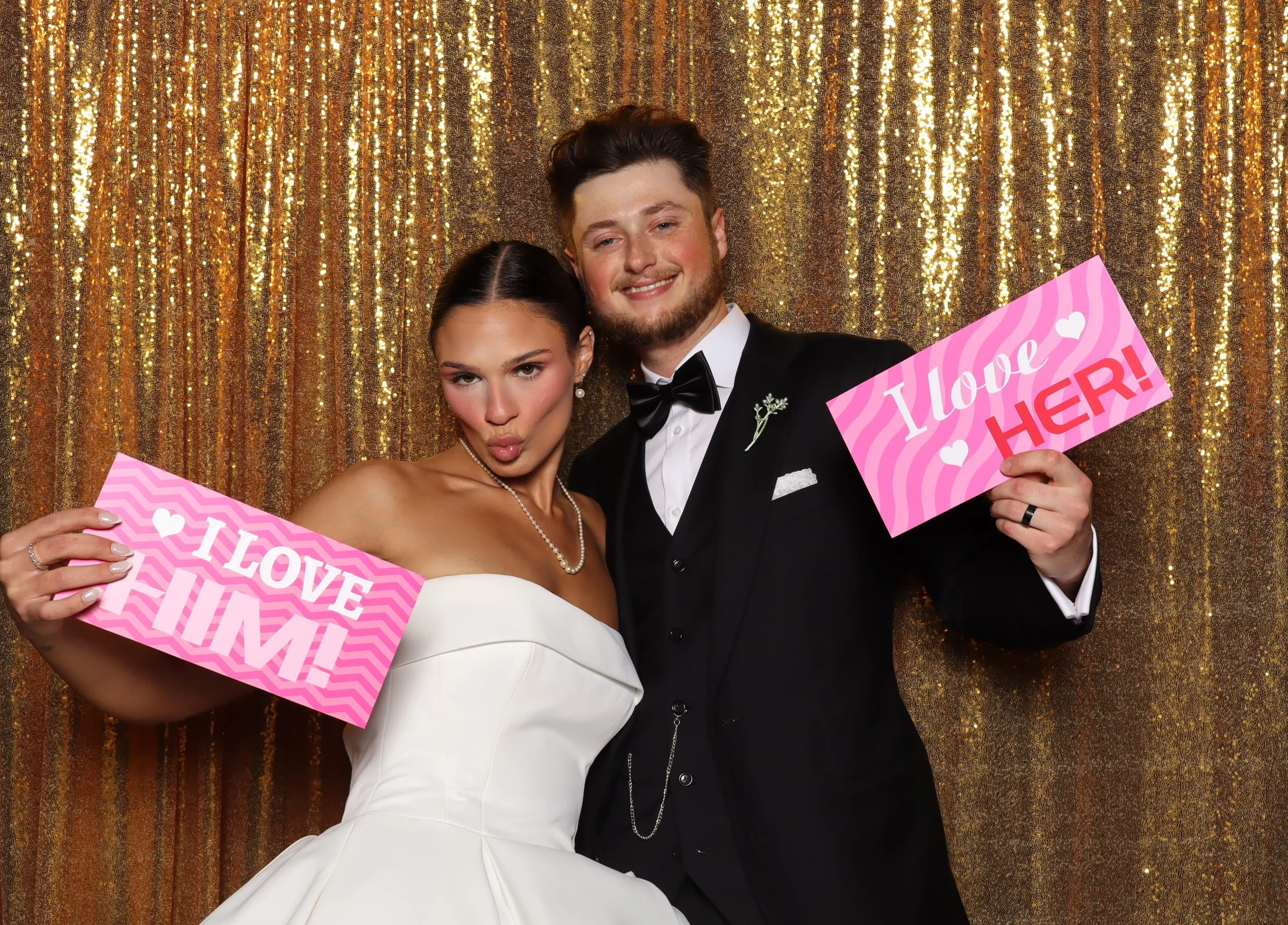 Wedding couple with I Love Him Her signs at photo booth rental in Orlando, FL — D&amp;L Photobooths