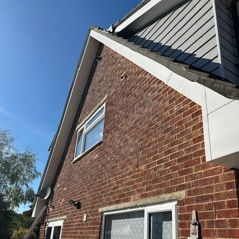 view of the rear of the bungalow showing newly fitted white UPVC bargeboards and soffits
