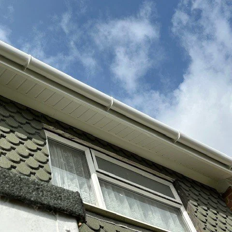view from under the eaves looking up to show white tongue and groove soffits