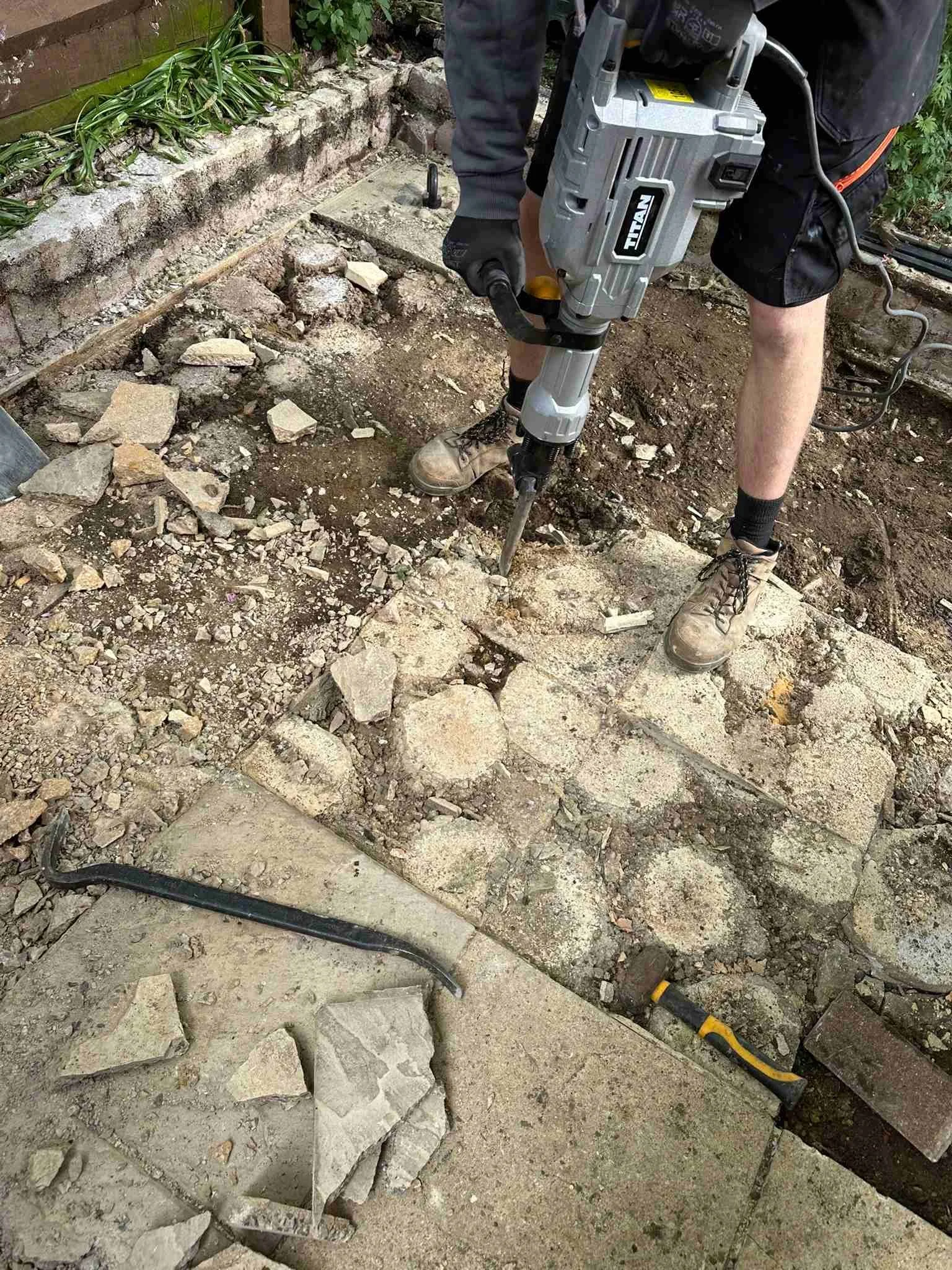 breaking up the old cement footings.jpg