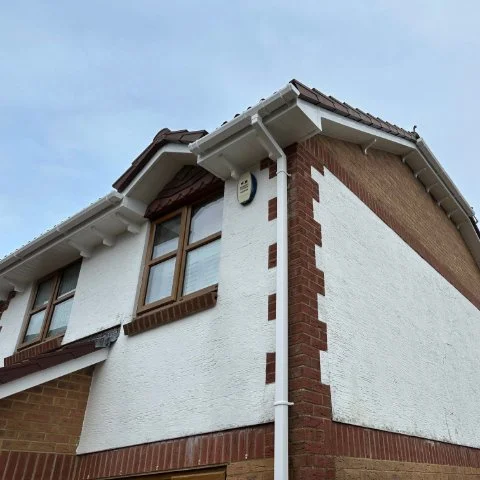 Side view of house in Broadstone Poole with new UPVC Fascias and Soffits and white UPVC bargeboards